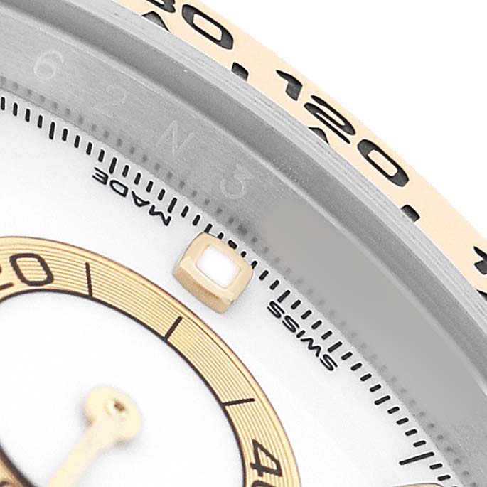 The image shows a close-up of the bezel and dial of a Rolex Daytona 116503 Men's Steel and Gold (two tone) White Dial, highlighting the tachymetric scale and part of the sub-dial.
