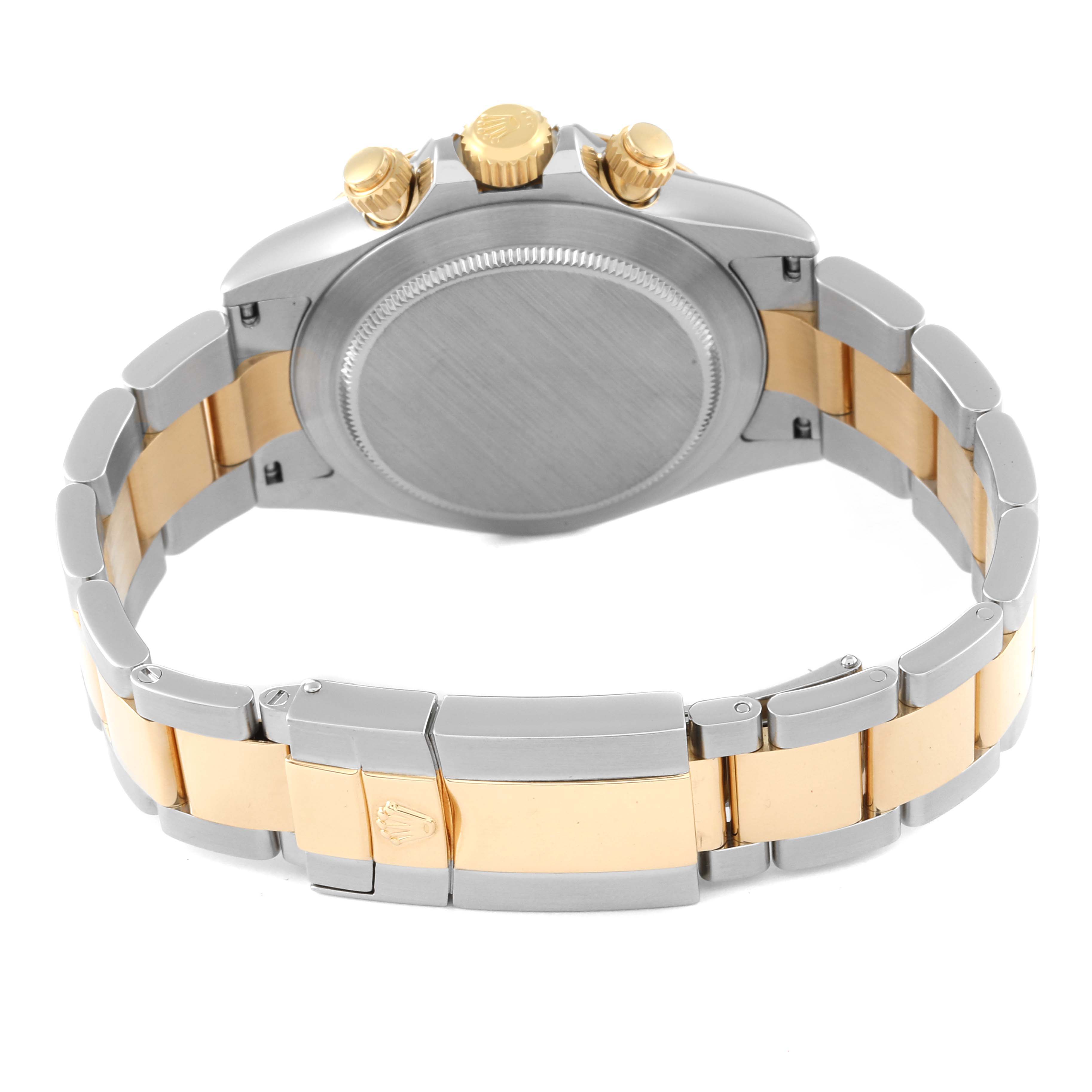 The Rolex Daytona 116523 Men
s Steel and Gold (two tone) White Dial 116523 Men
s Steel and Gold (two tone) White Dial watch is shown from the back, focusing on the case back, bracelet, and gold crown and pushers.