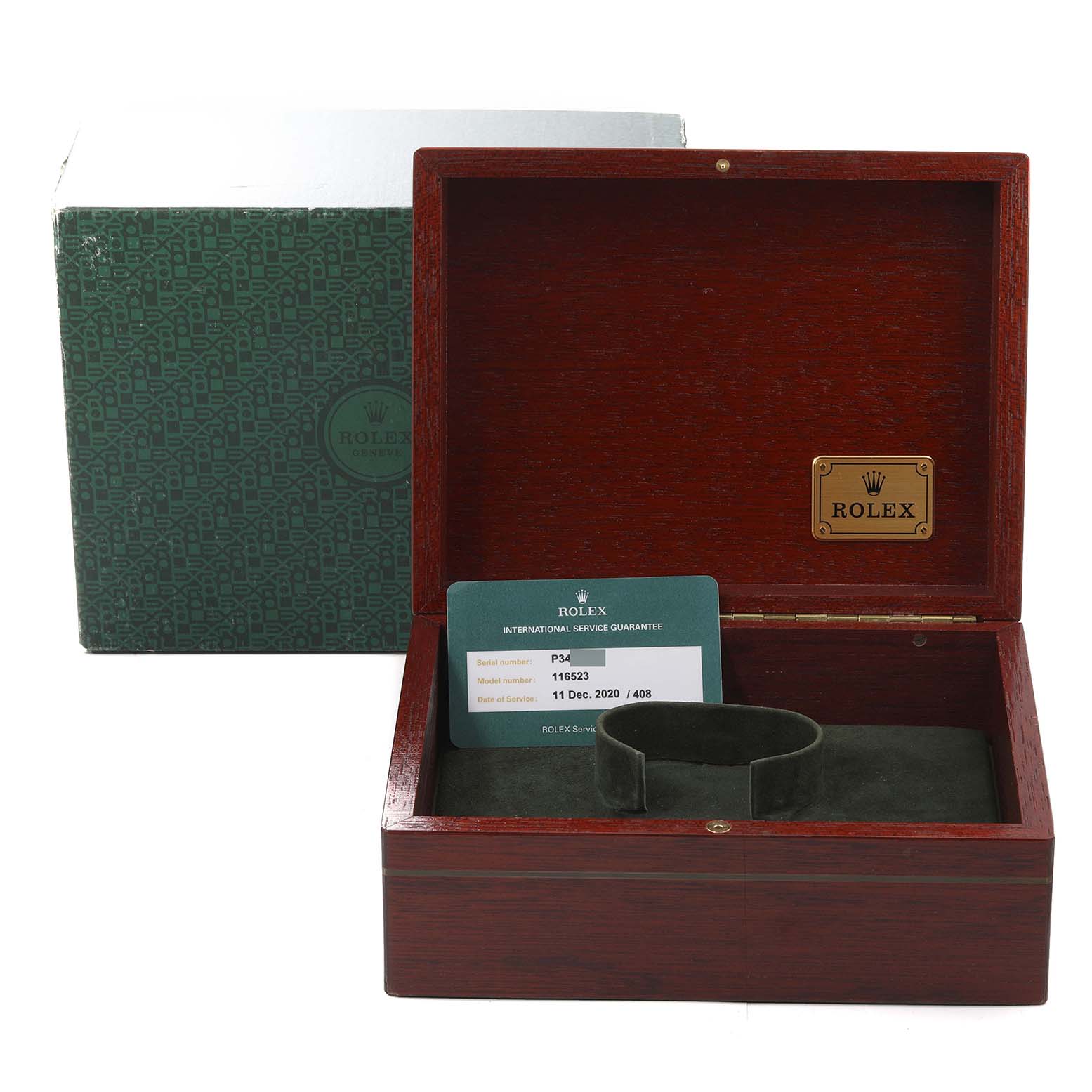 This image shows an open wooden Rolex watch box with documentation for a Daytona model.