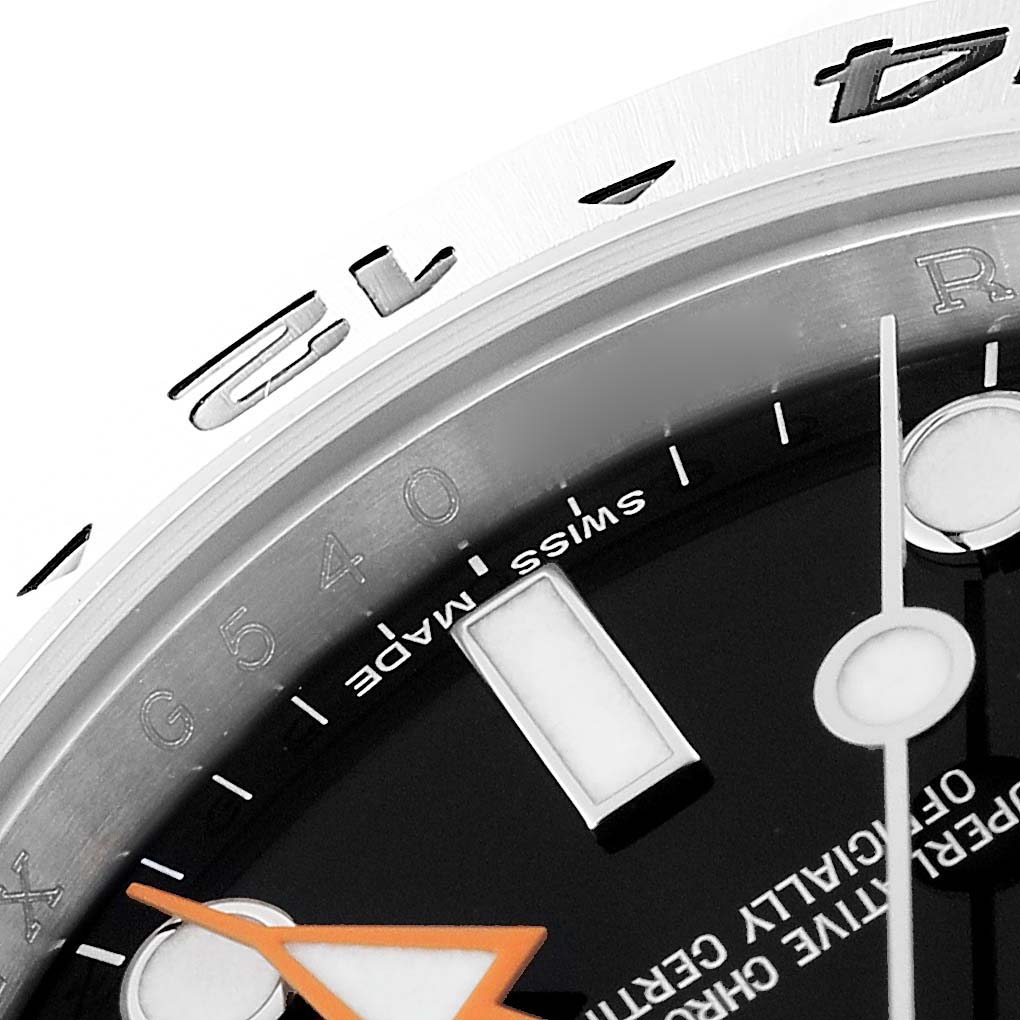 This image shows a close-up of the dial, bezel, and hour markers of a Rolex Explorer 216570 Men's Stainless Steel Black Dial 216570 Men's Stainless Steel Black Dial watch.