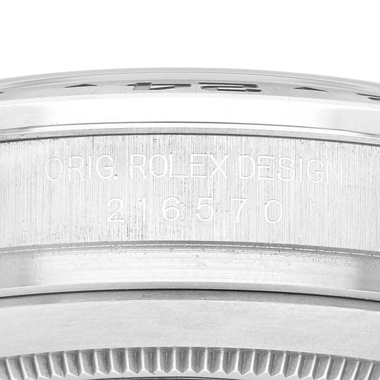 This is a close-up view of the side of the Rolex Explorer 216570 Men
s Stainless Steel White Dial 216570 Men
s Stainless Steel White Dial watch case, showing the engraving "ORIG. ROLEX DESIGN" and model number "216570."