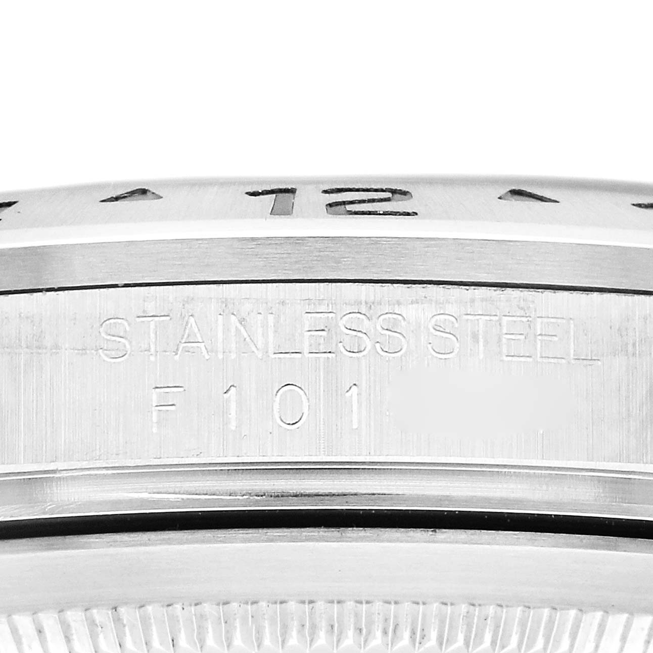 The image shows a close-up of the side of a Rolex Explorer 16570 Men
s Stainless Steel White Dial 16570 Men
s Stainless Steel White Dial watch, highlighting its stainless steel casing and engravings.