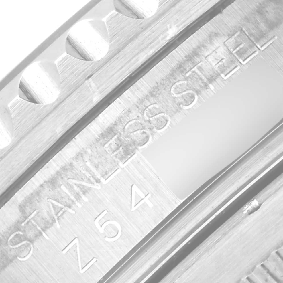 This is a close-up angle of the stainless steel caseback edge of a Rolex GMT-Master 16710 Men
s Stainless Steel Black Dial 16710 Men
s Stainless Steel Black Dial watch, showing engravings.