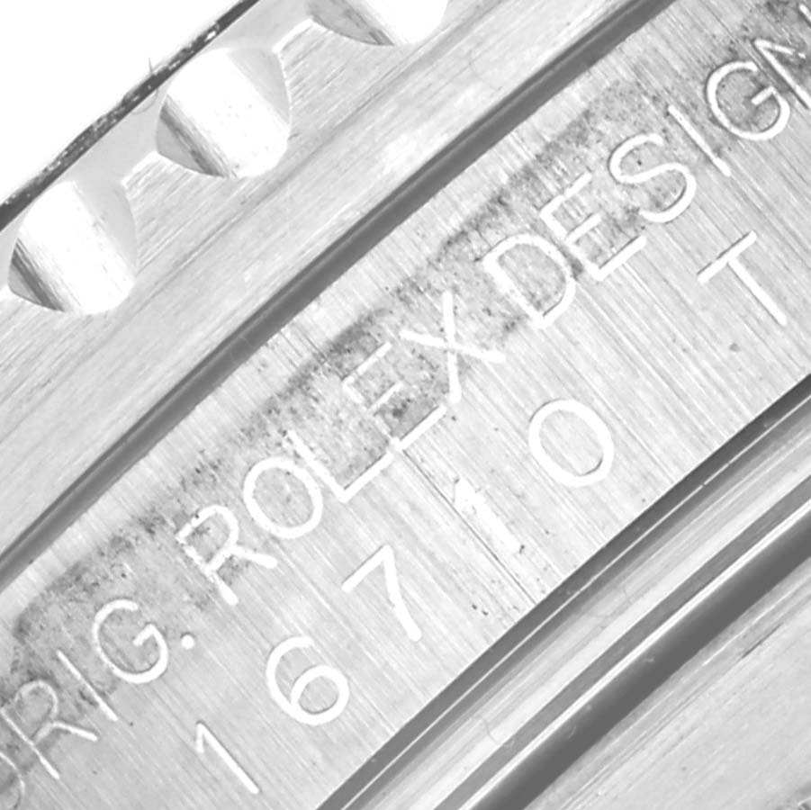 The image shows a close-up shot of the model and serial number engraving on the side of a Rolex GMT-Master 16710 Men
s Stainless Steel Black Dial 16710 Men
s Stainless Steel Black Dial watch.