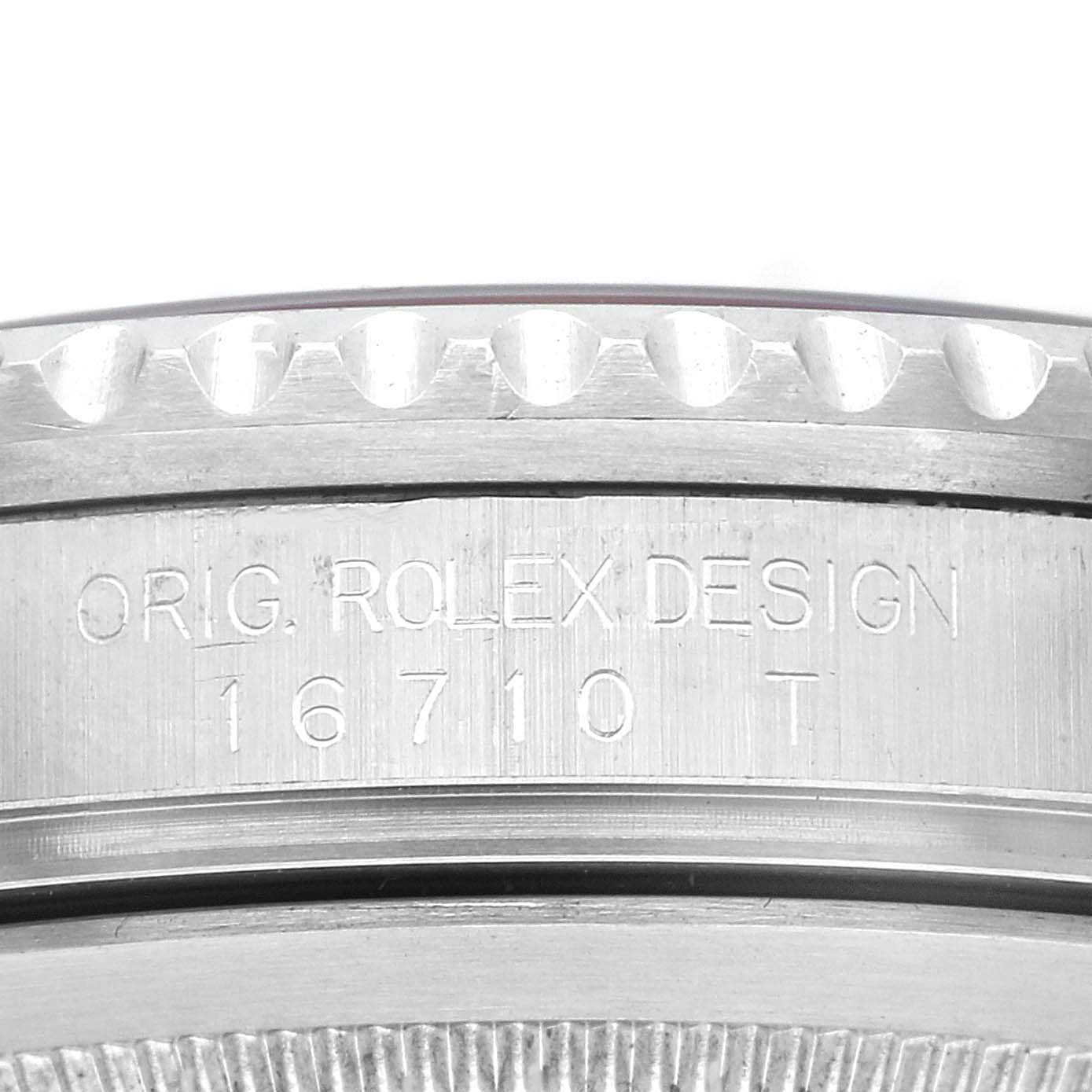 The image shows the side of a Rolex GMT-Master 16710 Men
s Stainless Steel Black Dial 16710 Men
s Stainless Steel Black Dial, focusing on the engraved text and bezel edge.