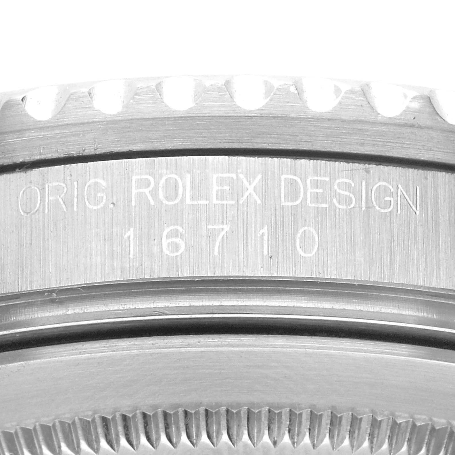 The image shows a close-up of the side engravings and bezel of a Rolex GMT-Master 16710 Men
s Stainless Steel Black Dial 16710 Men
s Stainless Steel Black Dial model 16710.