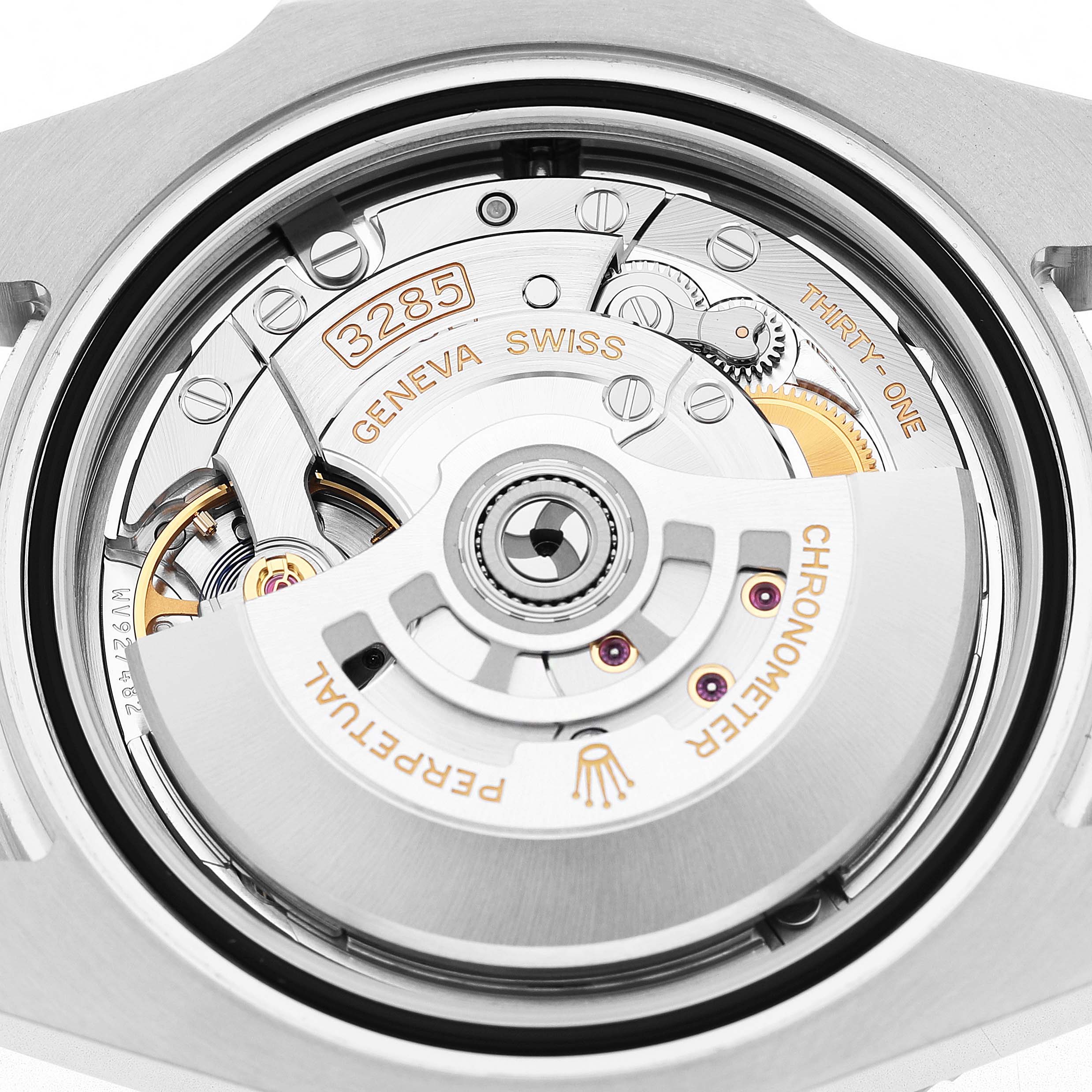 The image shows the movement and rotor of a Rolex GMT-Master M126710GRNR Men's Stainless Steel Black Dial, viewed from the back.