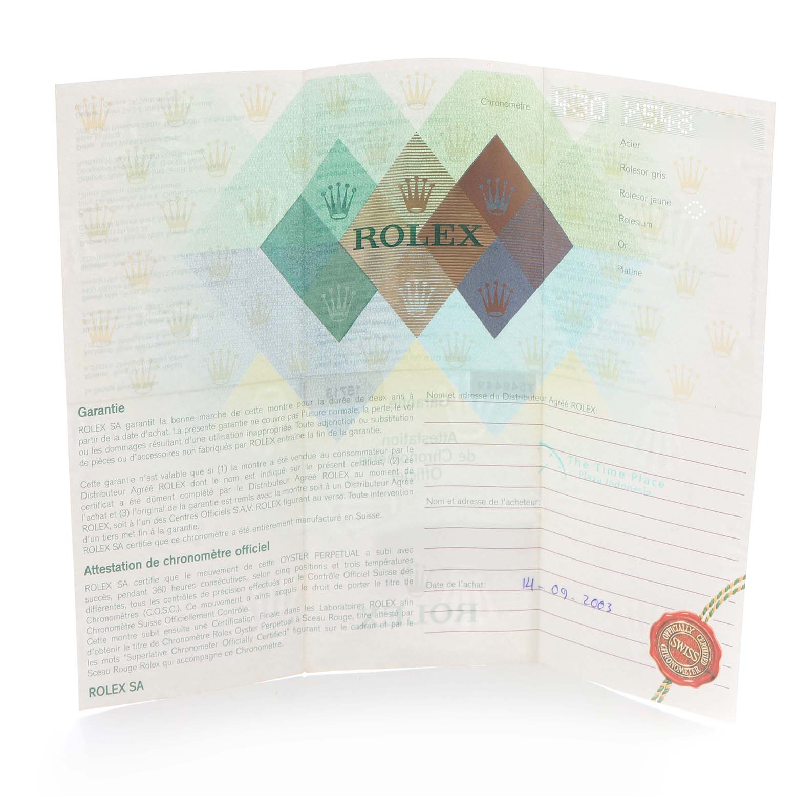 The image shows a Rolex warranty certificate for the GMT-Master model, displaying text and logos at a slight angle.