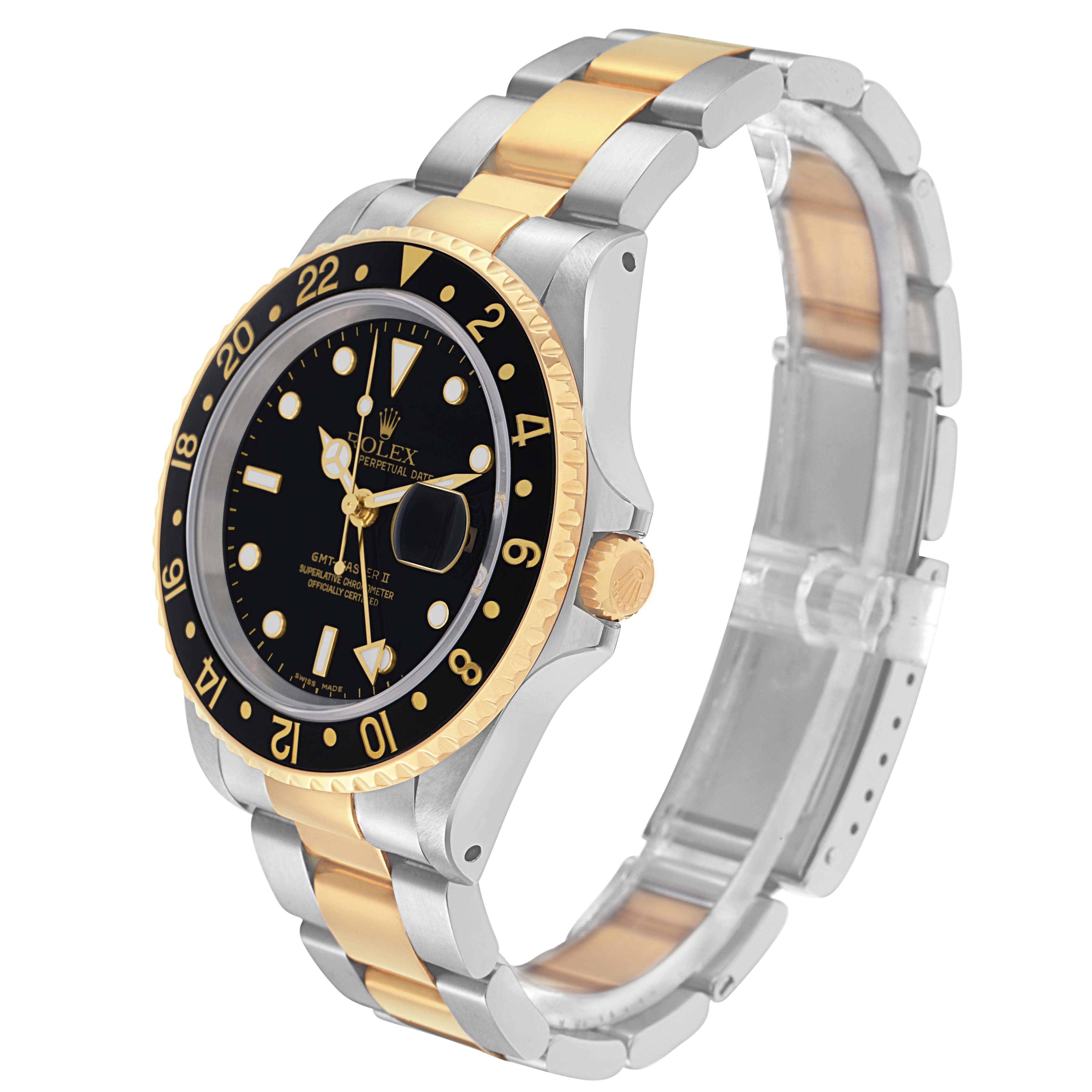 The Rolex GMT-Master 16713 Men
s Steel and Gold (two tone) Black Dial 16713 Men
s Steel and Gold (two tone) Black Dial watch is shown at a three-quarter angle, displaying the dial, bezel, crown, and part of the bracelet.