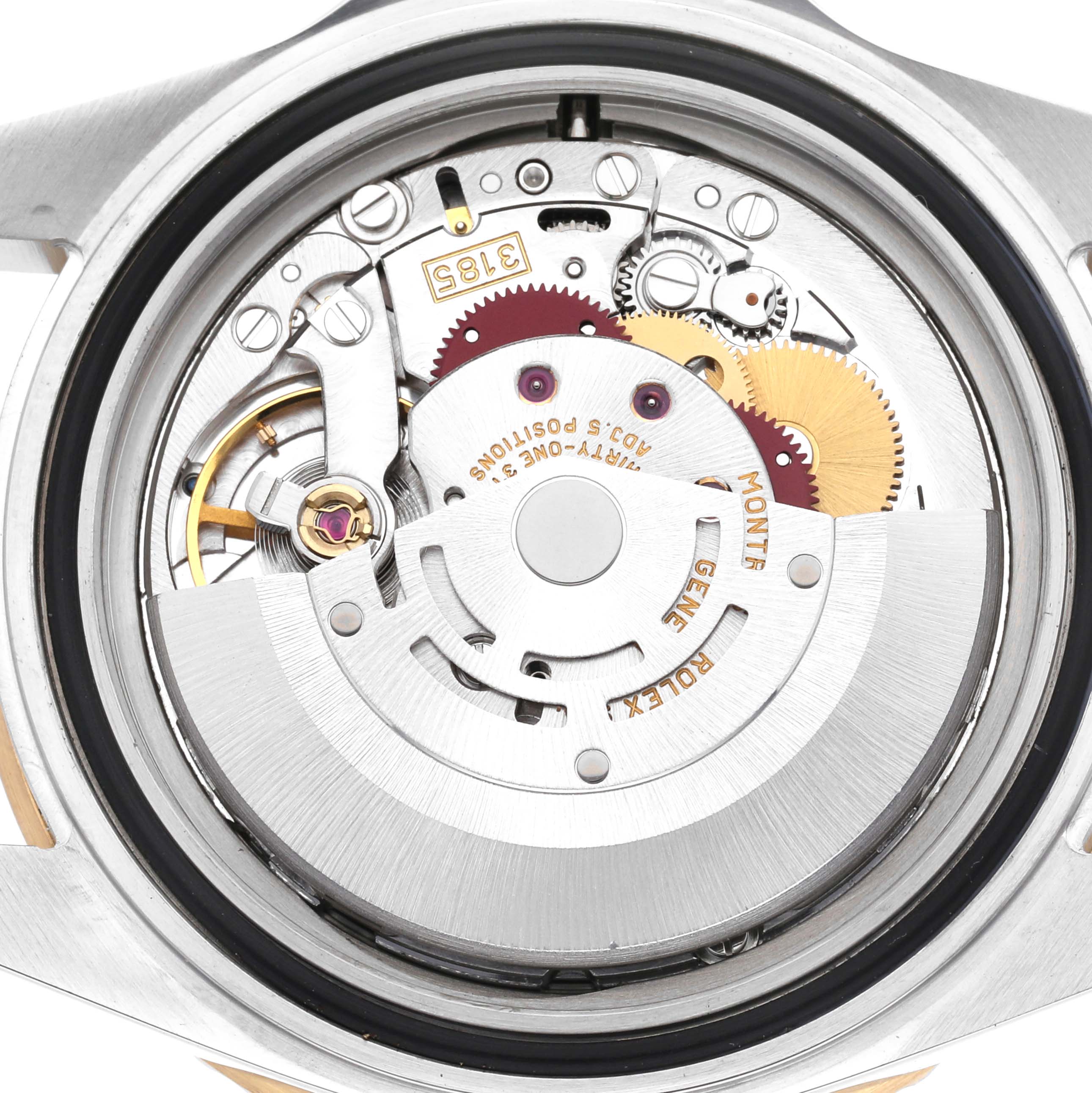 The image shows the internal mechanism of a Rolex GMT-Master 16713 Men
s Steel and Gold (two tone) Black Dial 16713 Men
s Steel and Gold (two tone) Black Dial watch, highlighting gears, cogs, and the rotor.