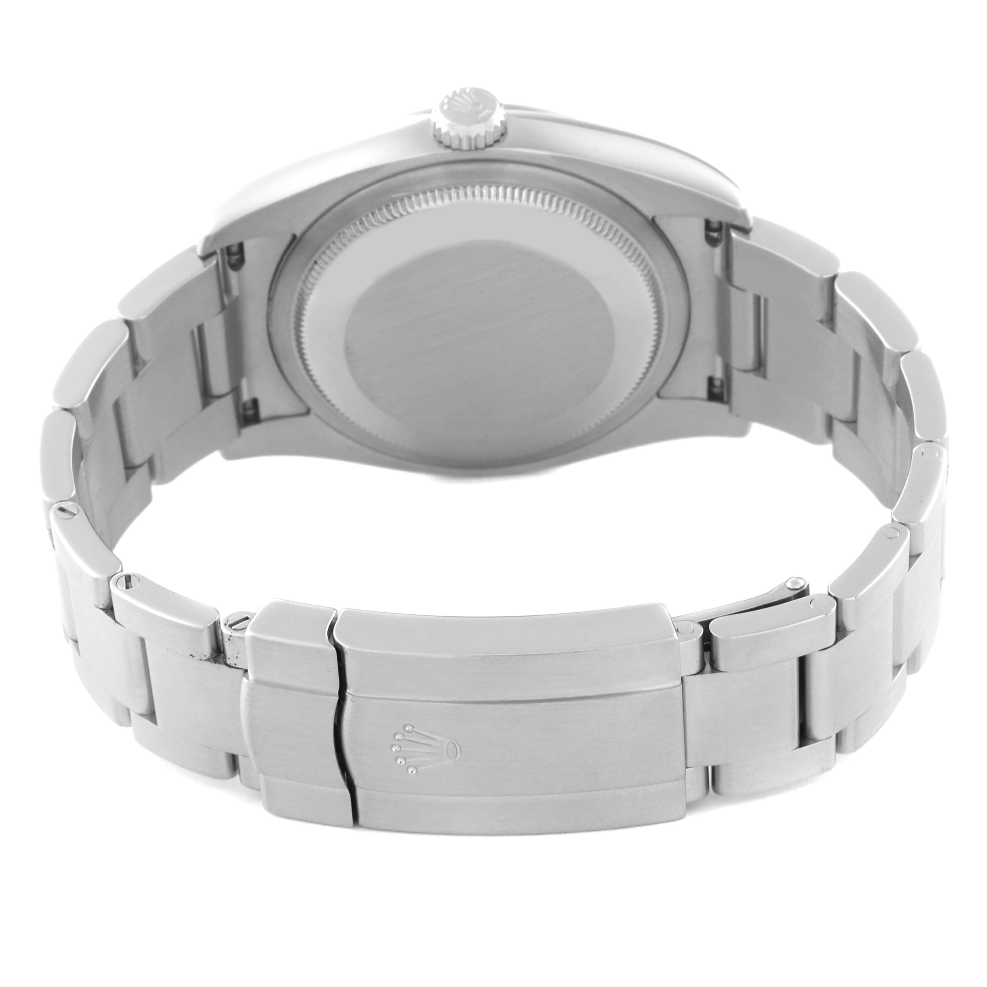 The image shows the back view of a Rolex Oyster Perpetual 116000 Men
s Stainless Steel Blue Dial 116000 Men
s Stainless Steel Blue Dial watch, highlighting the case back and the clasp of the bracelet.