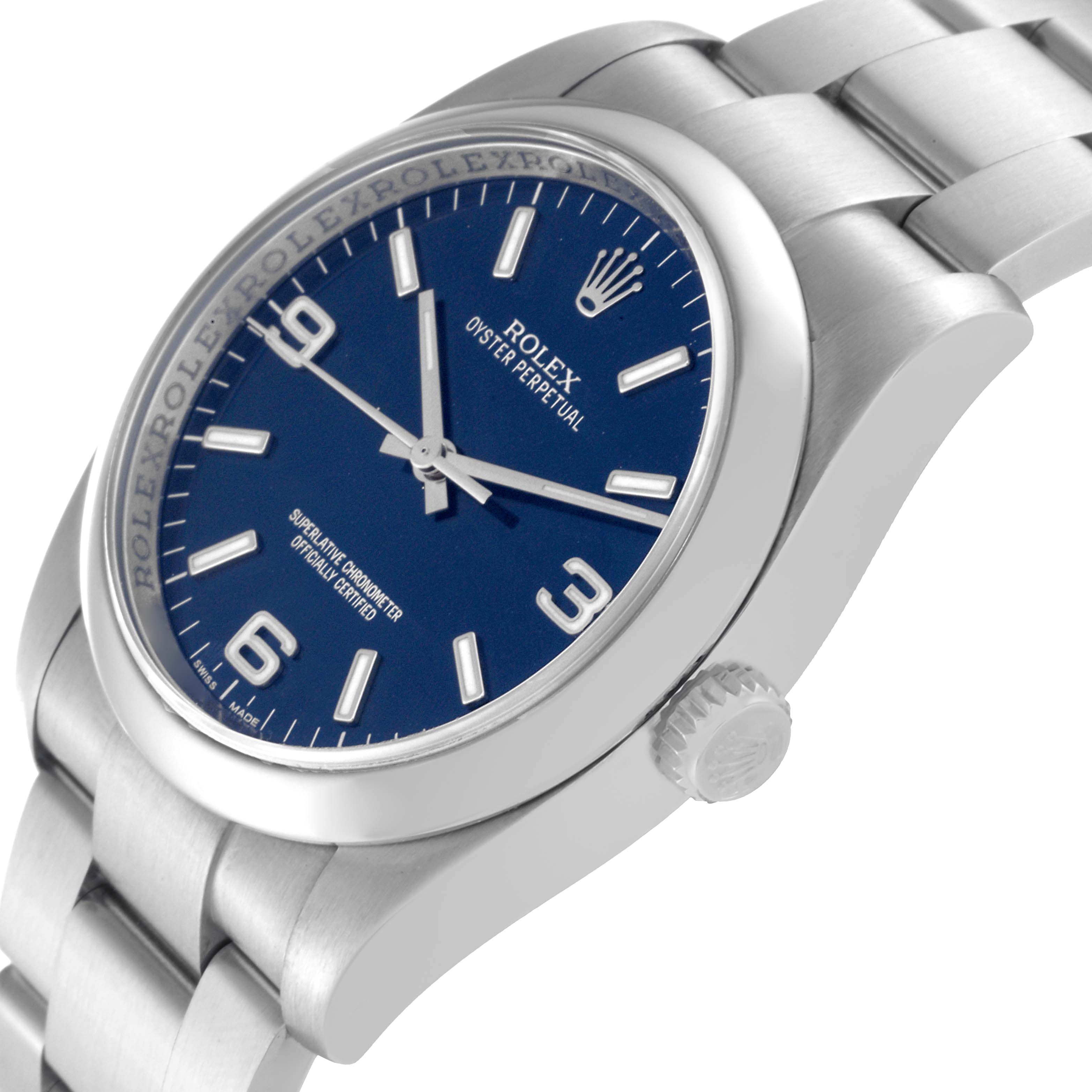The image shows the Rolex Oyster Perpetual 116000 Men
s Stainless Steel Blue Dial 116000 Men
s Stainless Steel Blue Dial watch from a slight angle, highlighting the blue dial, crown, and part of the bracelet.