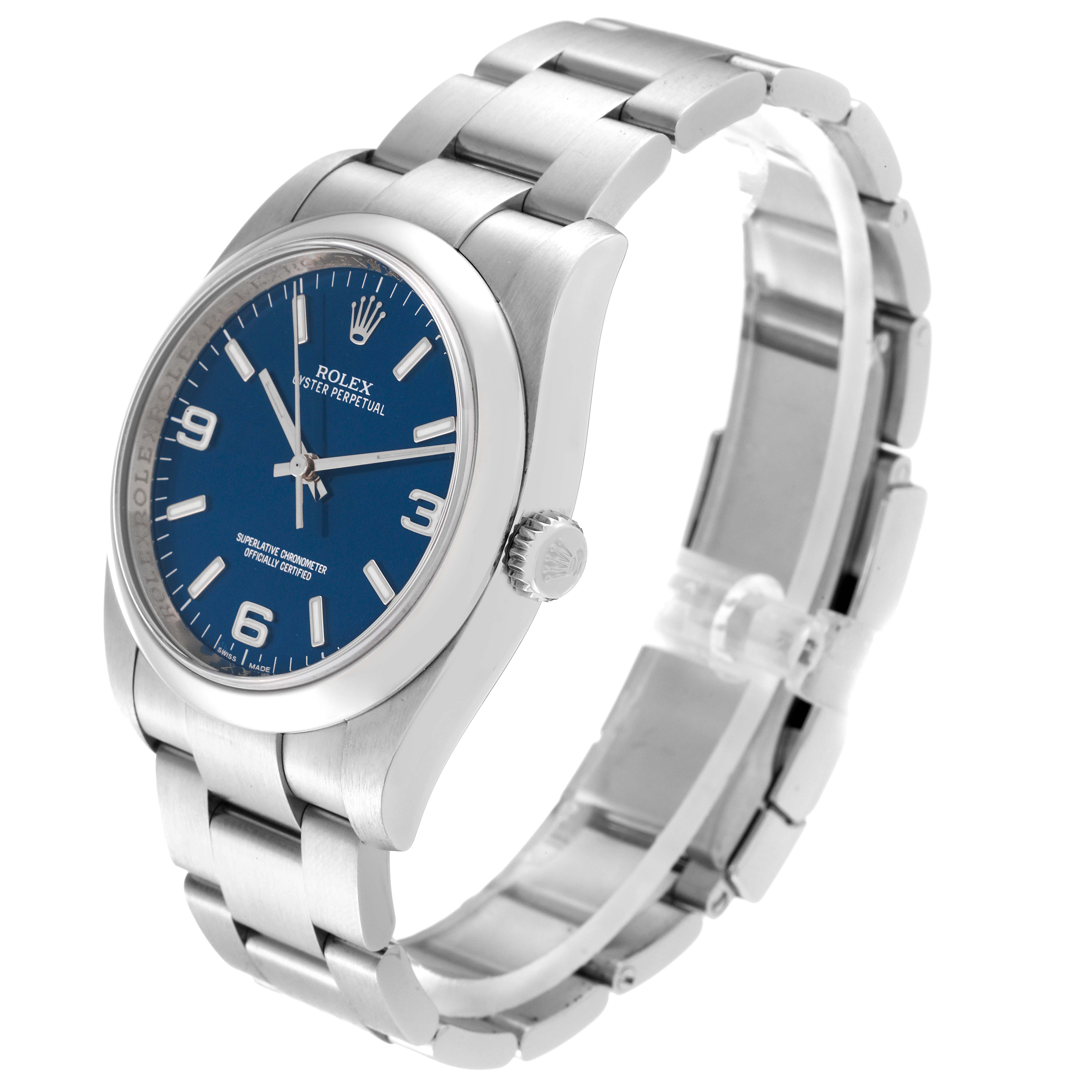 The Rolex Oyster Perpetual 116000 Men
s Stainless Steel Blue Dial 116000 Men
s Stainless Steel Blue Dial watch is shown at a tilted angle, highlighting the blue dial, bracelet, and side crown.