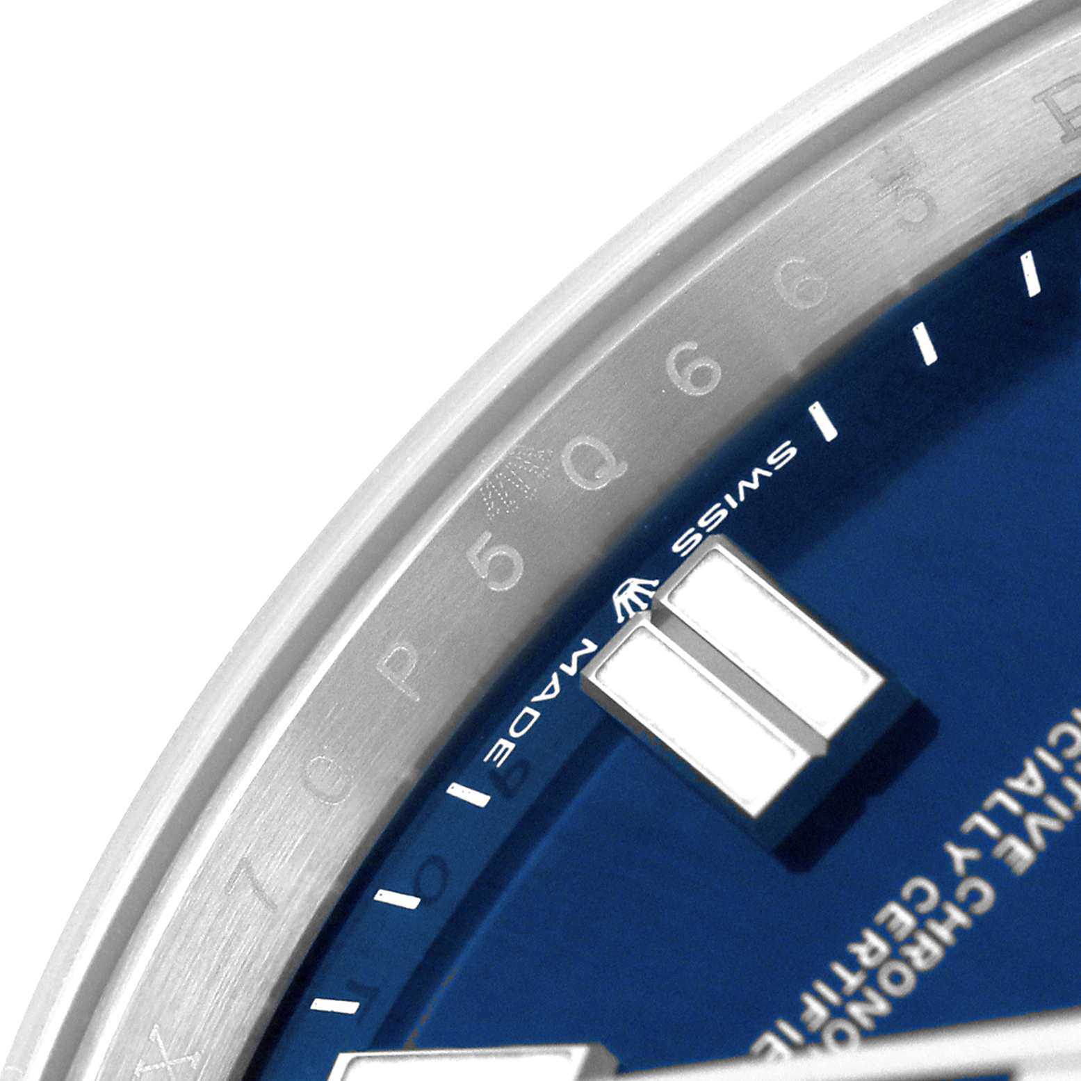 The image shows a close-up of the Rolex Oyster Perpetual 124300 Men's Stainless Steel Blue Dial dial, highlighting the blue face, indices, and part of the bezel.