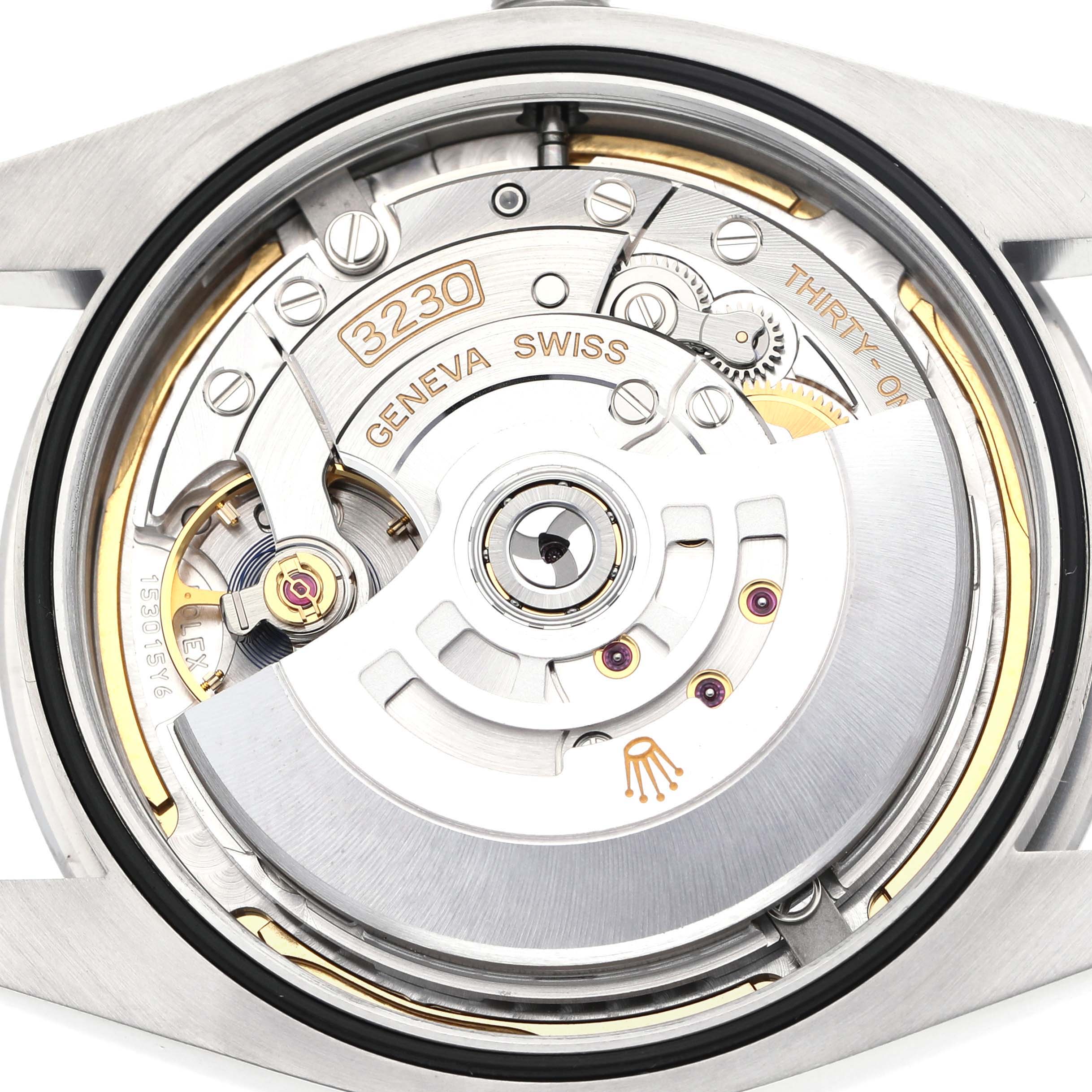 The image shows the back of a Rolex Oyster Perpetual 124300 Men's Stainless Steel Blue Dial watch, displaying its intricate movement and rotor.