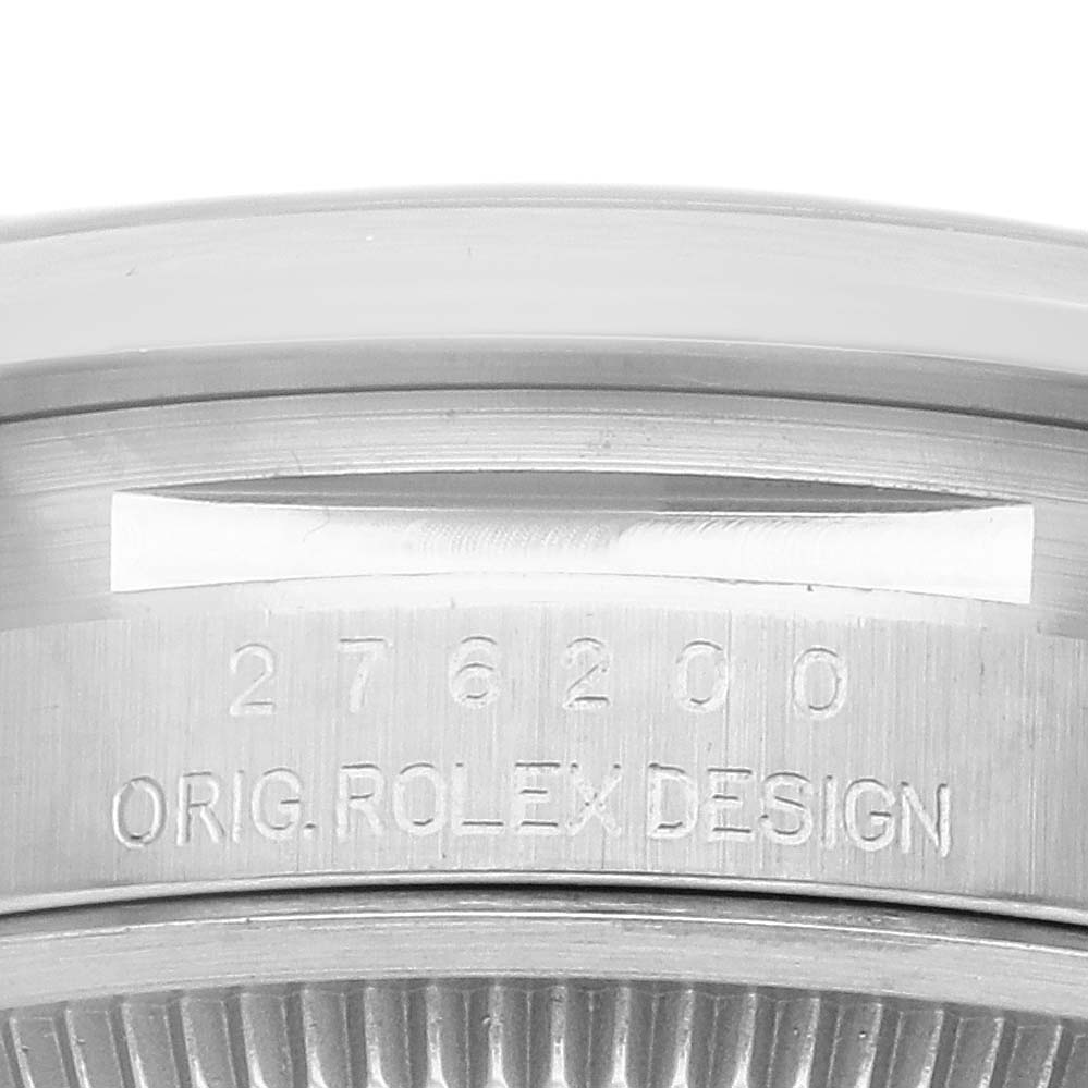 This image shows a close-up of the engraved serial number and "ORIG. ROLEX DESIGN" text on the case of a Rolex Oyster Perpetual 276200 Women's Stainless Steel Pink Dial 276200 Women's Stainless Steel Pink Dial watch.