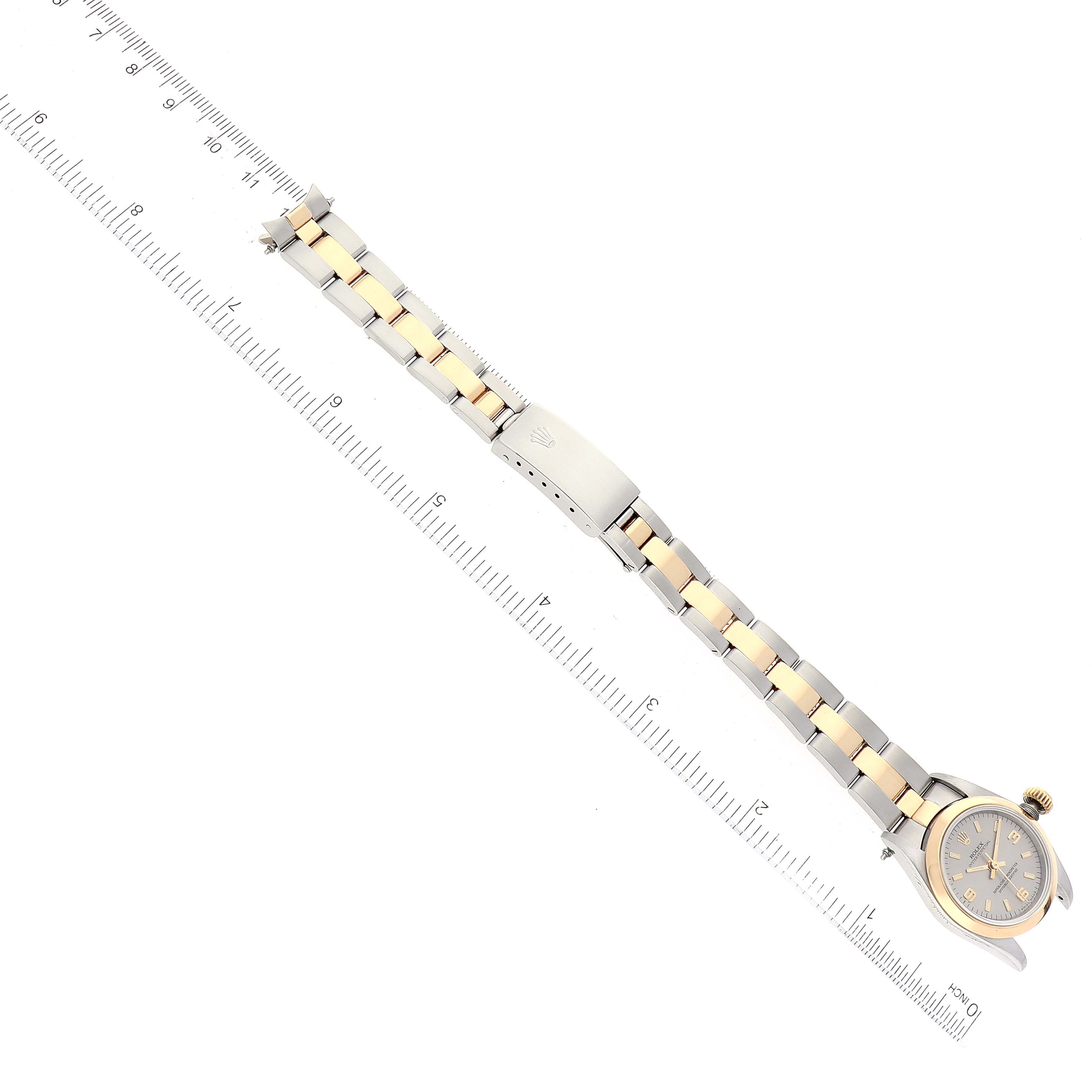 The image shows a top-down view of a Rolex Oyster Perpetual 67183 Women's Steel and Gold (two tone) Grey Dial 67183 Women's Steel and Gold (two tone) Grey Dial watch, displaying its face, bracelet, and clasp.