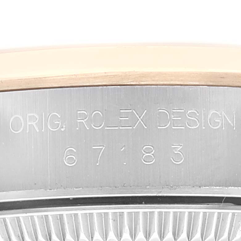 The image shows a close-up of the Oyster Perpetual Rolex watch case with model number 67183 engraved.