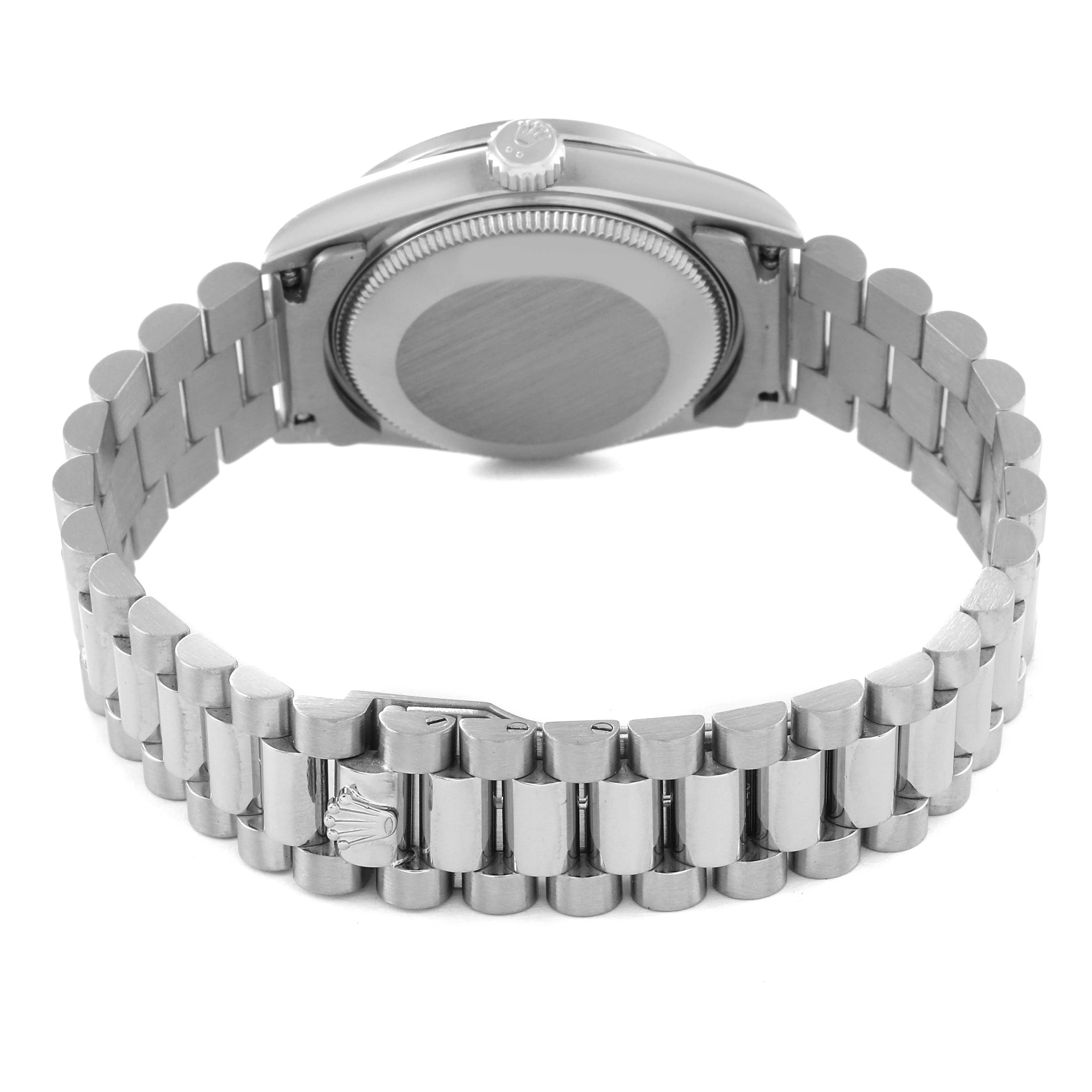 The image shows the back view of a Rolex President 68289 Women's White Gold Silver Dial 68289 Women's White Gold Silver Dial model watch with a focus on its case back and bracelet.