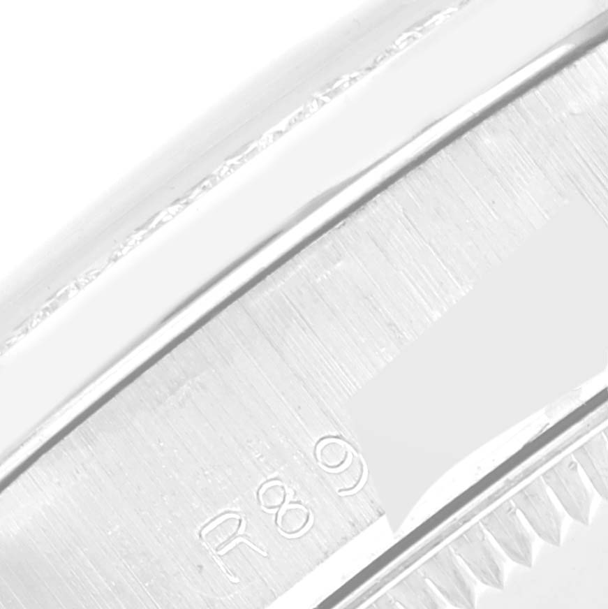 This close-up image shows the side view of the bezel and part of the case back of a Rolex President 68289 Women's White Gold Silver Dial 68289 Women's White Gold Silver Dial model watch.