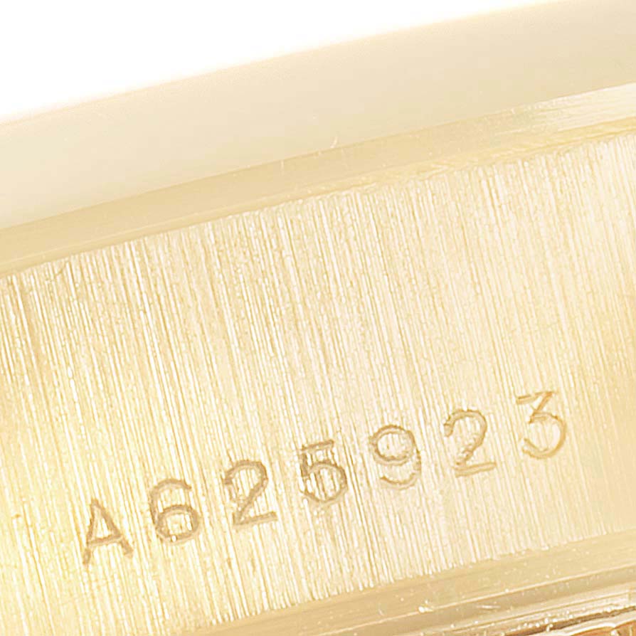 The image shows a close-up of the serial number engraved on the casing of a Rolex President 79168 Women
s Yellow Gold Mother of Pearl Dial 79168 Women
s Yellow Gold Mother of Pearl Dial model watch.