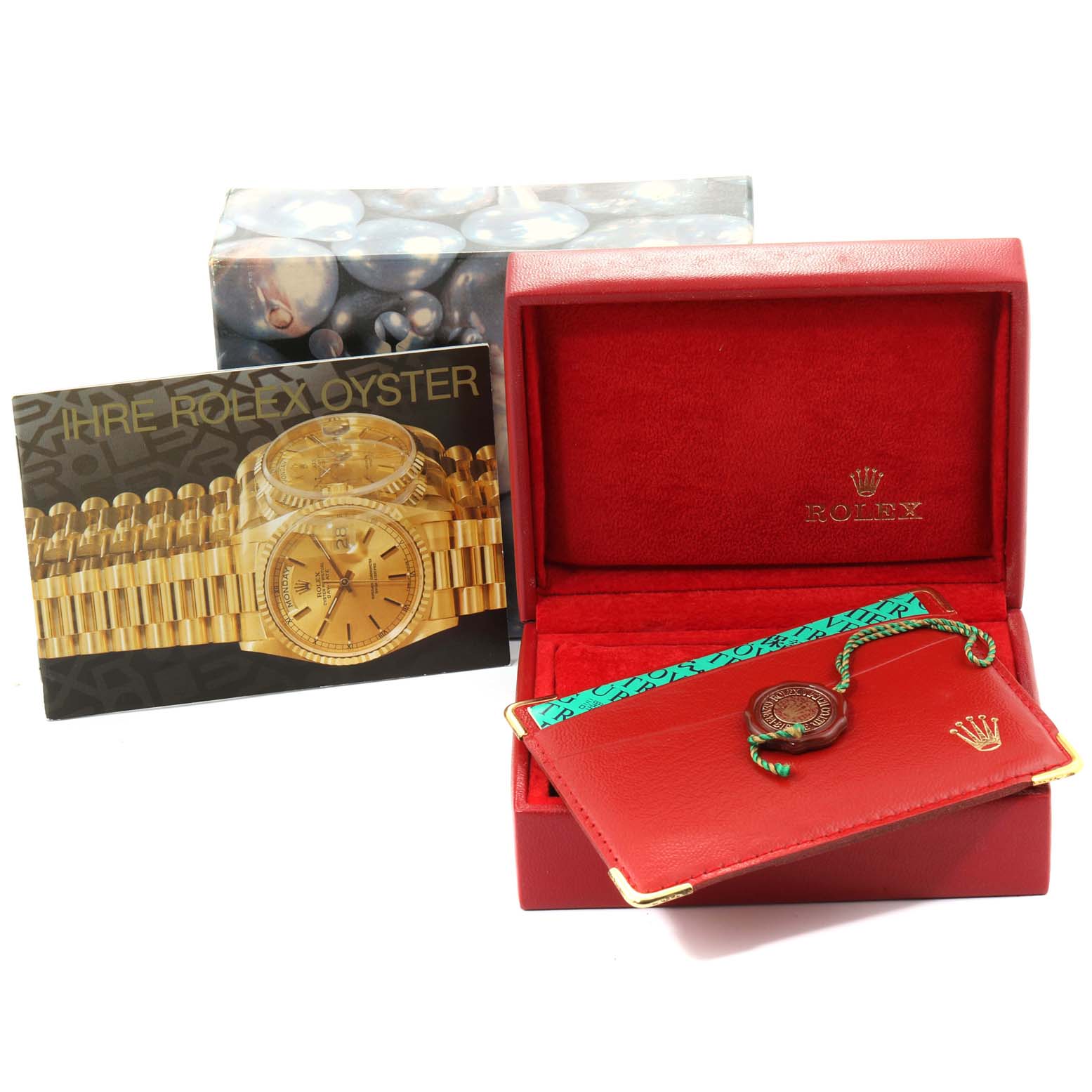 The image shows a Rolex President 79168 Women
s Yellow Gold Mother of Pearl Dial 79168 Women
s Yellow Gold Mother of Pearl Dial model watch
s packaging, including a red box, tag, and booklet with watch image.