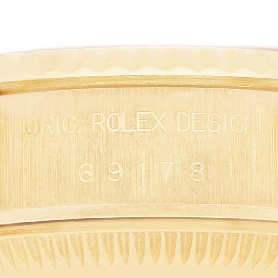 The image shows a close-up of the side engraving on the Rolex President 69178 Women
s Yellow Gold Champagne Dial 69178 Women
s Yellow Gold Champagne Dial model, highlighting the model number.
