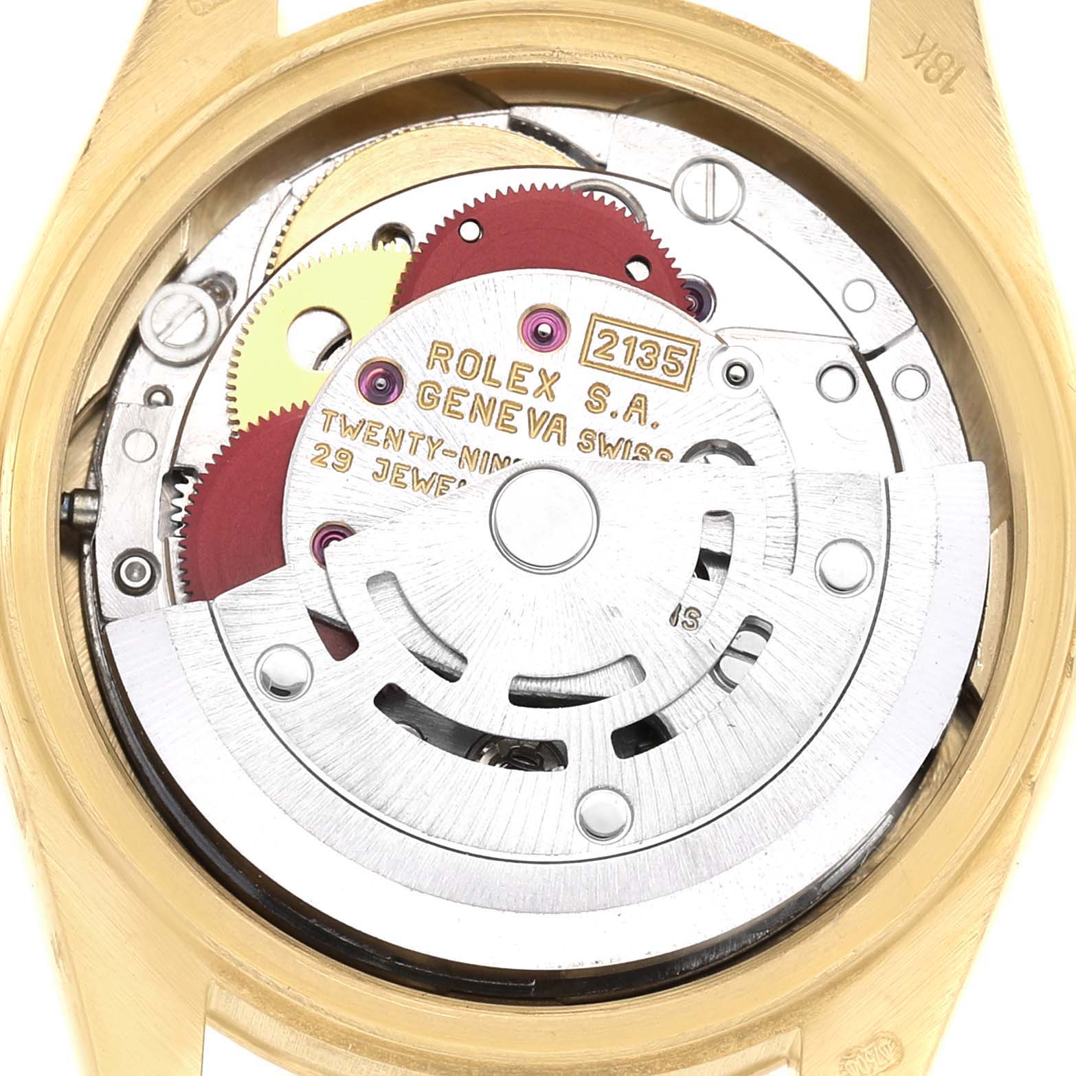 The image shows the movement mechanism of a Rolex President 69178 Women's Yellow Gold Champagne Dial watch, highlighting the gears and rotor from a top view.