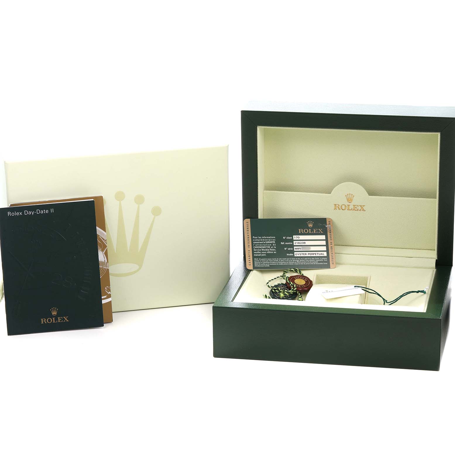 The image shows the packaging and accompanying materials of a Rolex President 218239 Men's White Gold Silver Dial model, including the box, manual, and authenticity card.