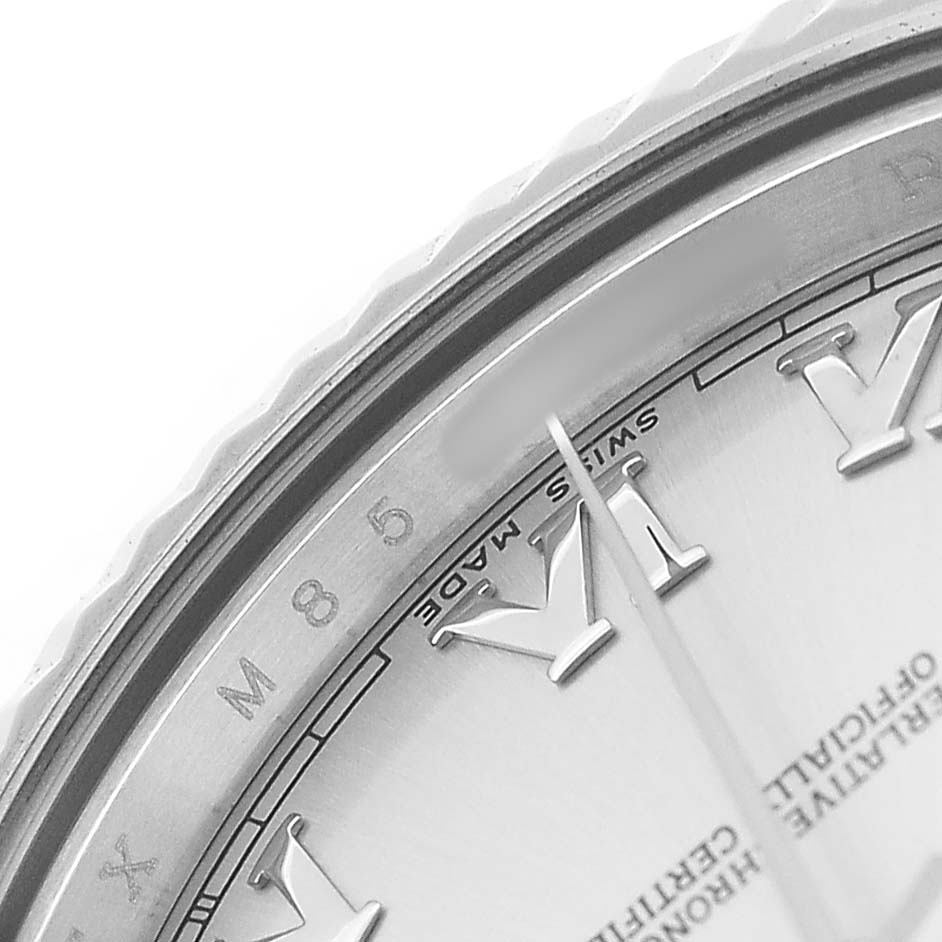 The image shows a close-up of the bezel, dial, and part of the hands of a Rolex President 218239 Men's White Gold Silver Dial watch.