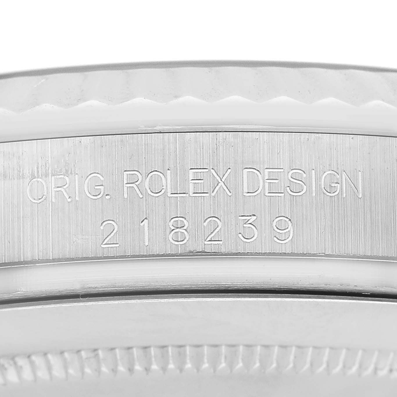 The image shows a close-up of the case side detailing on a Rolex President 218239 Men's White Gold Silver Dial, featuring engraved text and the model number.