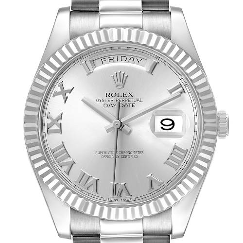The Rolex President 218239 Men's White Gold Silver Dial model is shown from a front angle, highlighting the dial, fluted bezel, day, and date display.