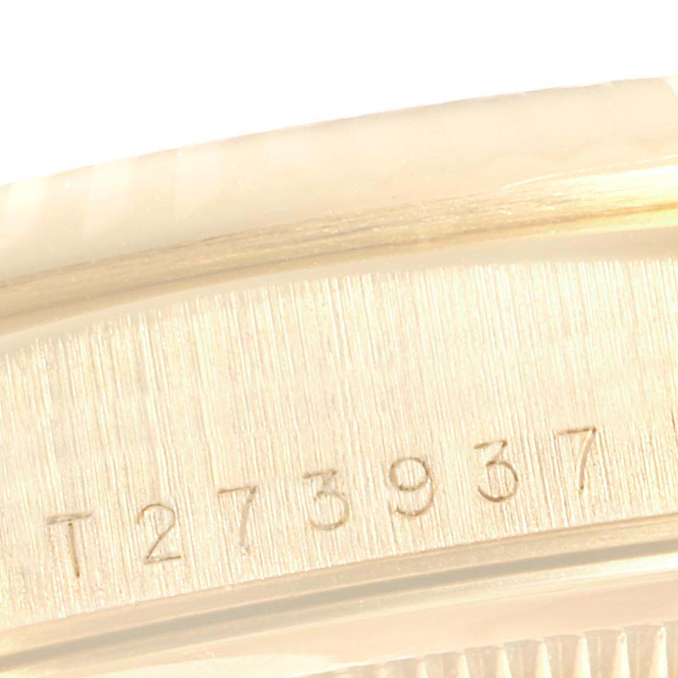 The close-up image shows the serial number engraved on the side of the bezel of a Rolex President 18388 Men
s Yellow Gold Champagne Dial 18388 Men
s Yellow Gold Champagne Dial model watch.