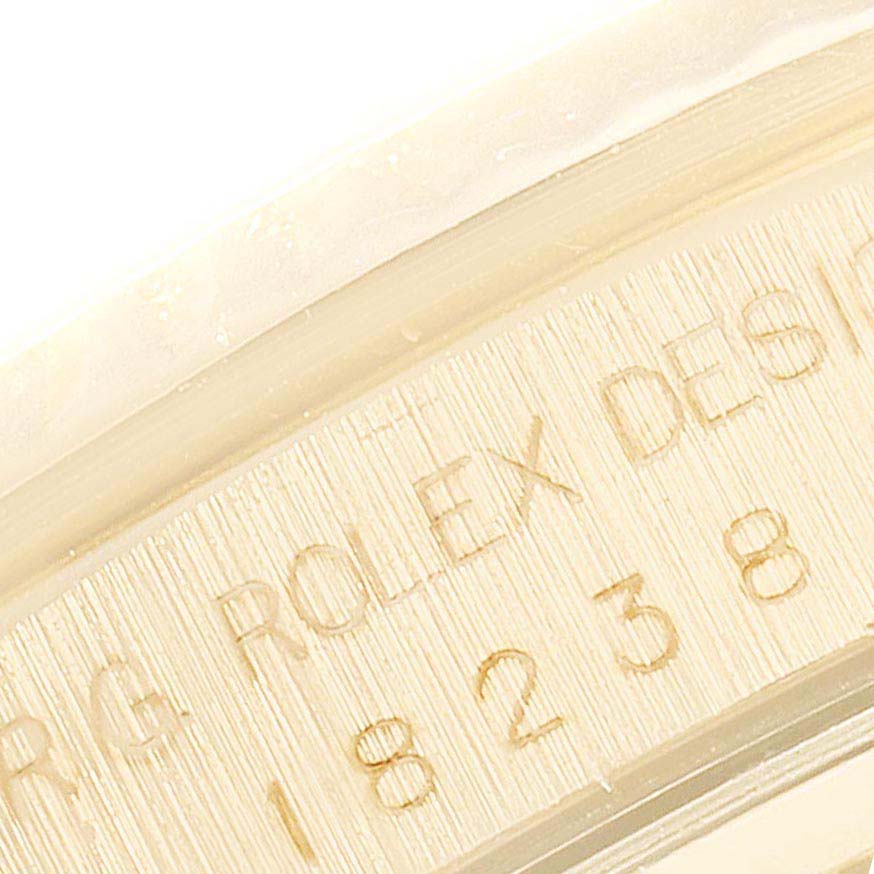 This image shows the inner bezel with engraved details of a Rolex President 18388 Men
s Yellow Gold Champagne Dial 18388 Men
s Yellow Gold Champagne Dial model watch.