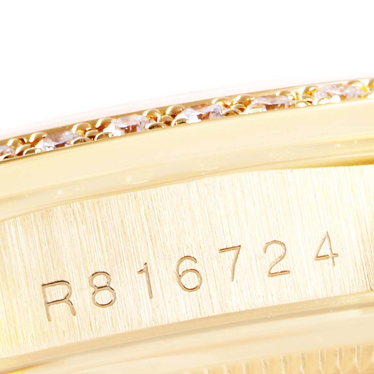 The image shows a close-up view of the case side and part of the bezel with the serial number on a Rolex President 18388 Men's Yellow Gold Champagne Dial 18388 Men's Yellow Gold Champagne Dial model watch.