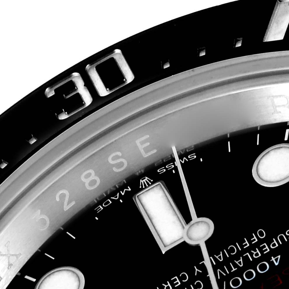 The image shows a close-up angle of the bezel, part of the dial, and hands of the Rolex Sea-Dweller 126600 Men
s Stainless Steel Black Dial 126600 Men
s Stainless Steel Black Dial watch.