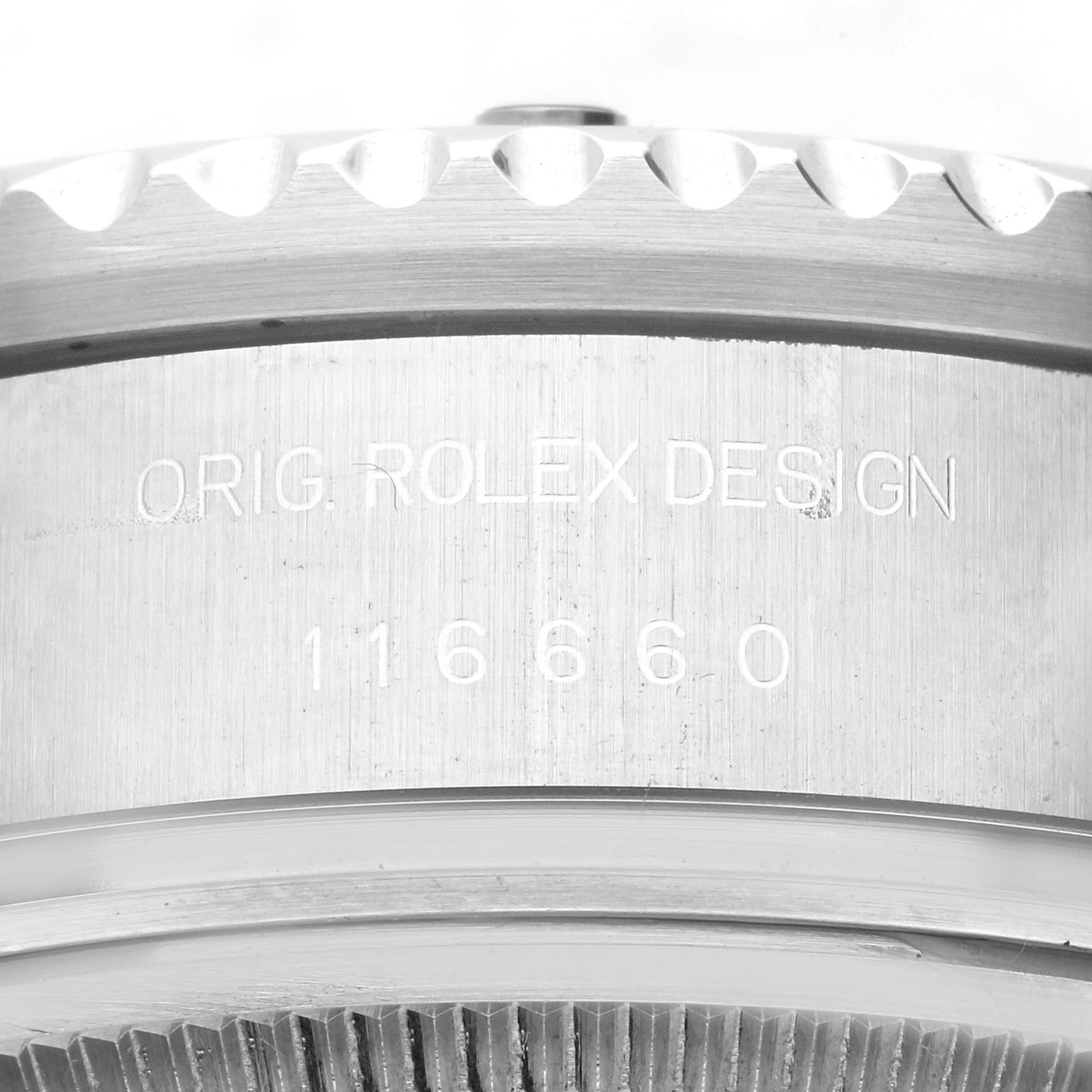 This image shows a close-up angle of the side of the Rolex Sea-Dweller 116660 Men's Stainless Steel Black Dial 116660 Men's Stainless Steel Black Dial's case, featuring its serial number and the "ORIG. ROLEX DESIGN" engraving.