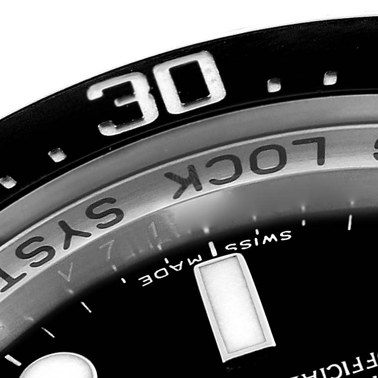 This image shows a close-up of the bezel and part of the dial of a Rolex Sea-Dweller 116660 Men's Stainless Steel Black Dial 116660 Men's Stainless Steel Black Dial watch, highlighting the "SWISS MADE" text and "30" bezel marking.