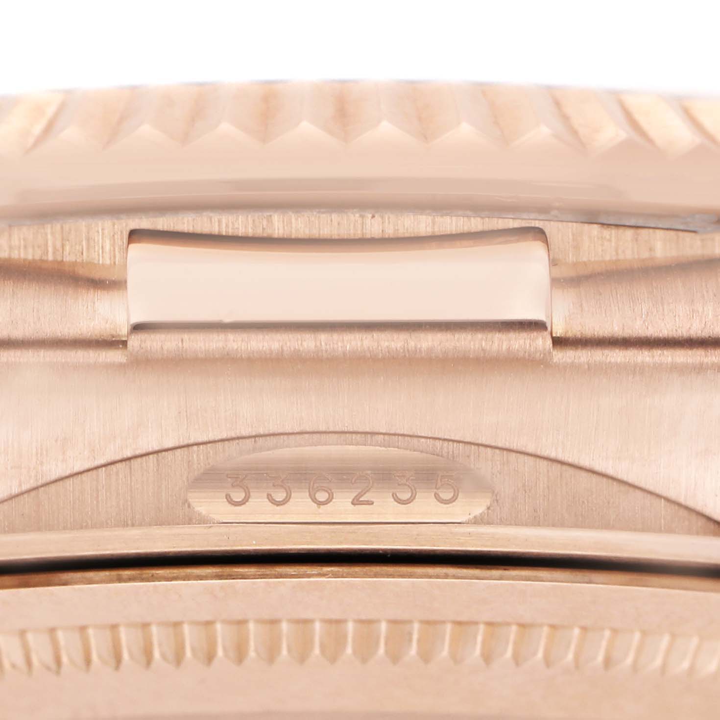 The image shows a close-up of the Rolex Sky-Dweller 336235 Men's Rose Gold Brown Dial's clasp area, focusing on the serial number and bracelet link detail.