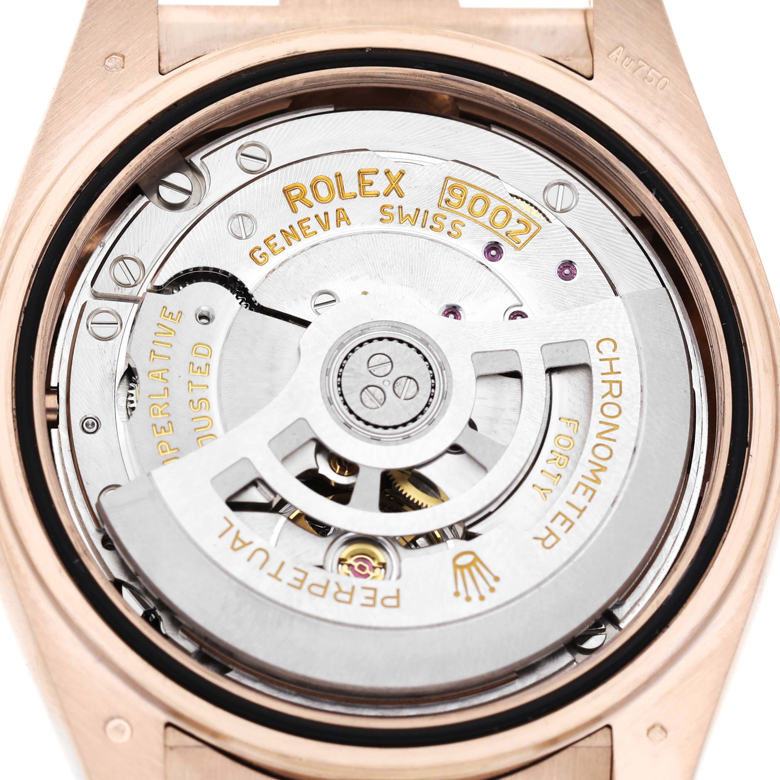 The image shows the movement of a Rolex Sky-Dweller 336235 Men's Rose Gold Brown Dial, showcasing its intricate mechanical components from the back.