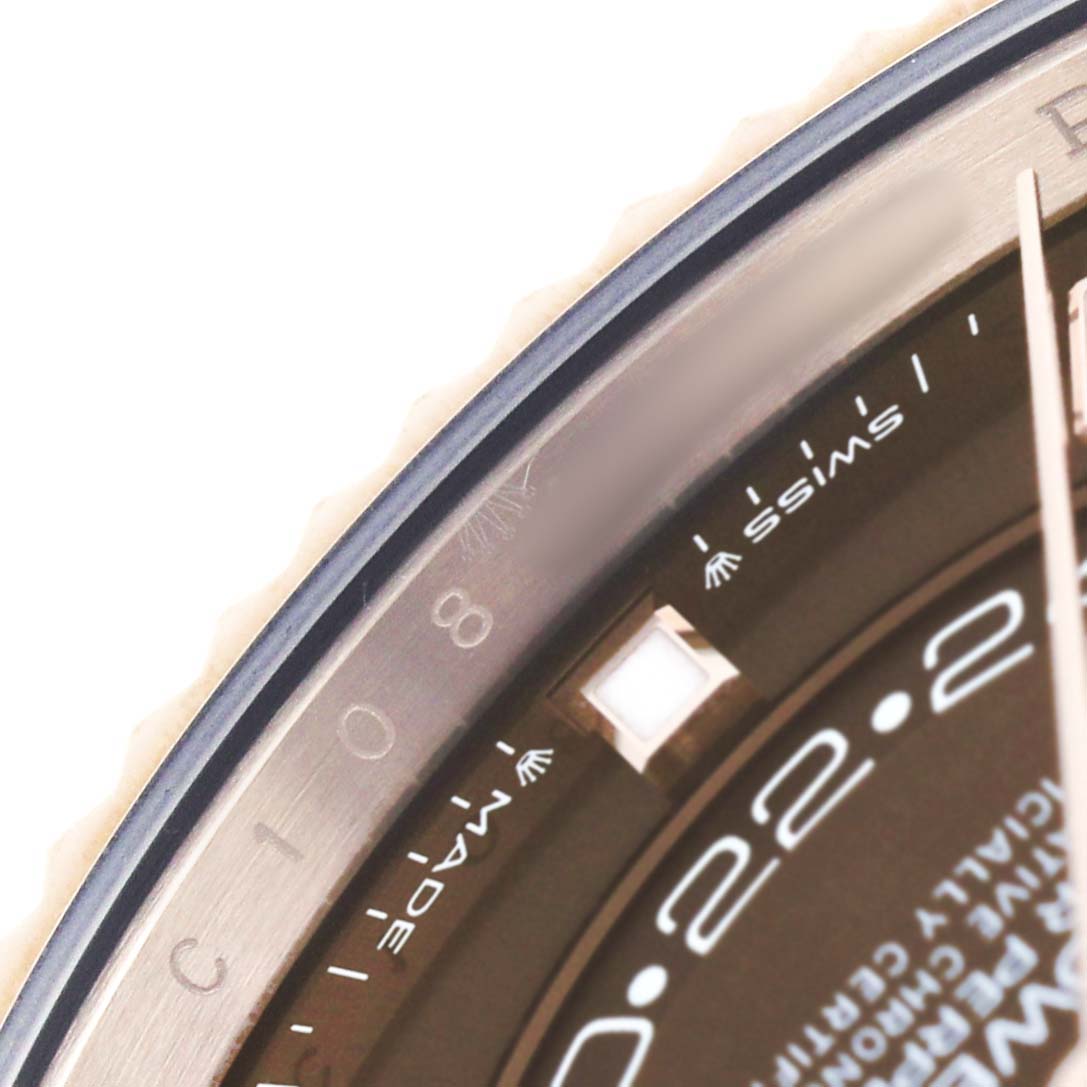 The image shows a close-up of the Rolex Sky-Dweller 336235 Men's Rose Gold Brown Dial's dial edge, bezel, and markers on the side of the watch face.