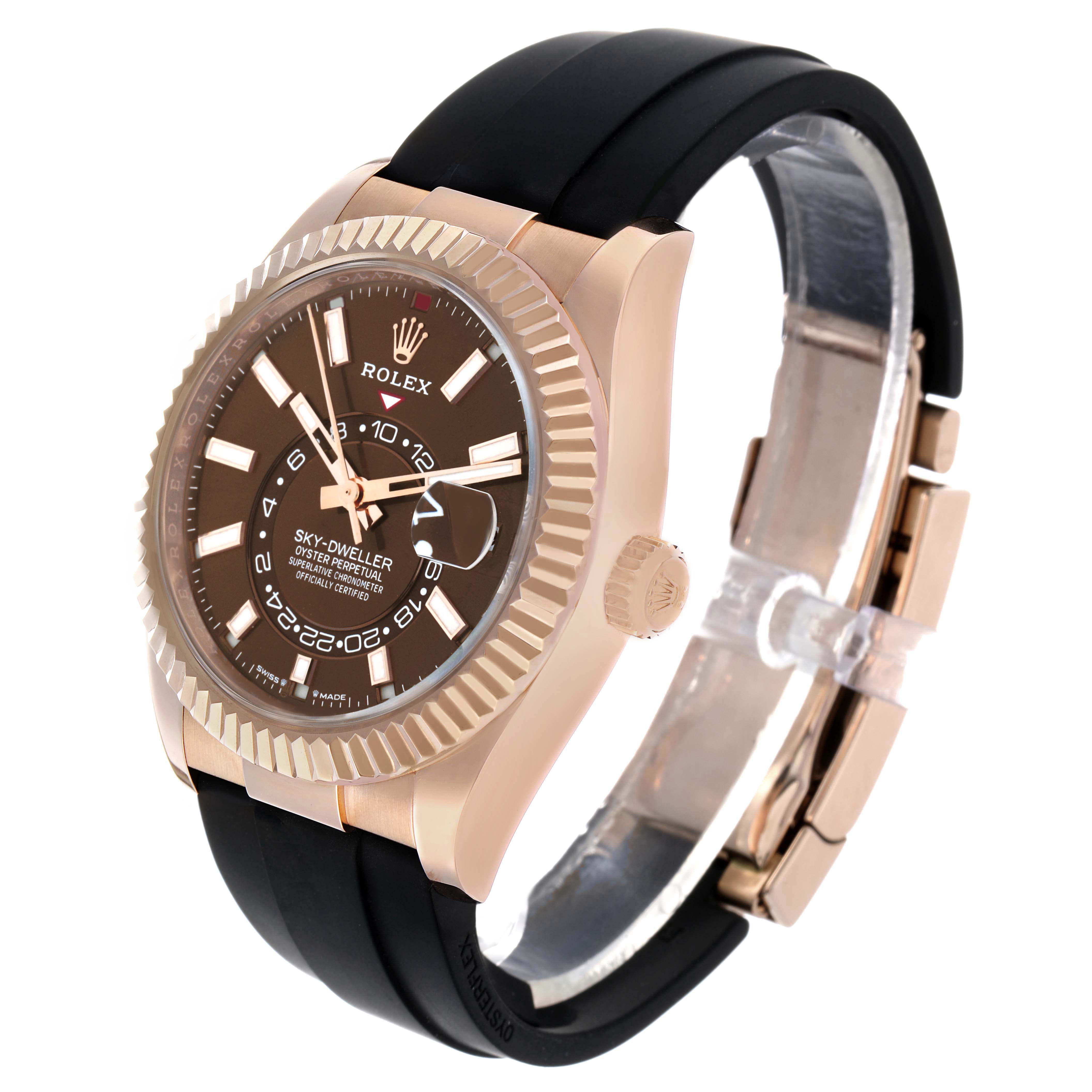 The Rolex Sky-Dweller 336235 Men's Rose Gold Brown Dial watch is shown at a three-quarter angle, highlighting the bezel, dial, crown, and strap.