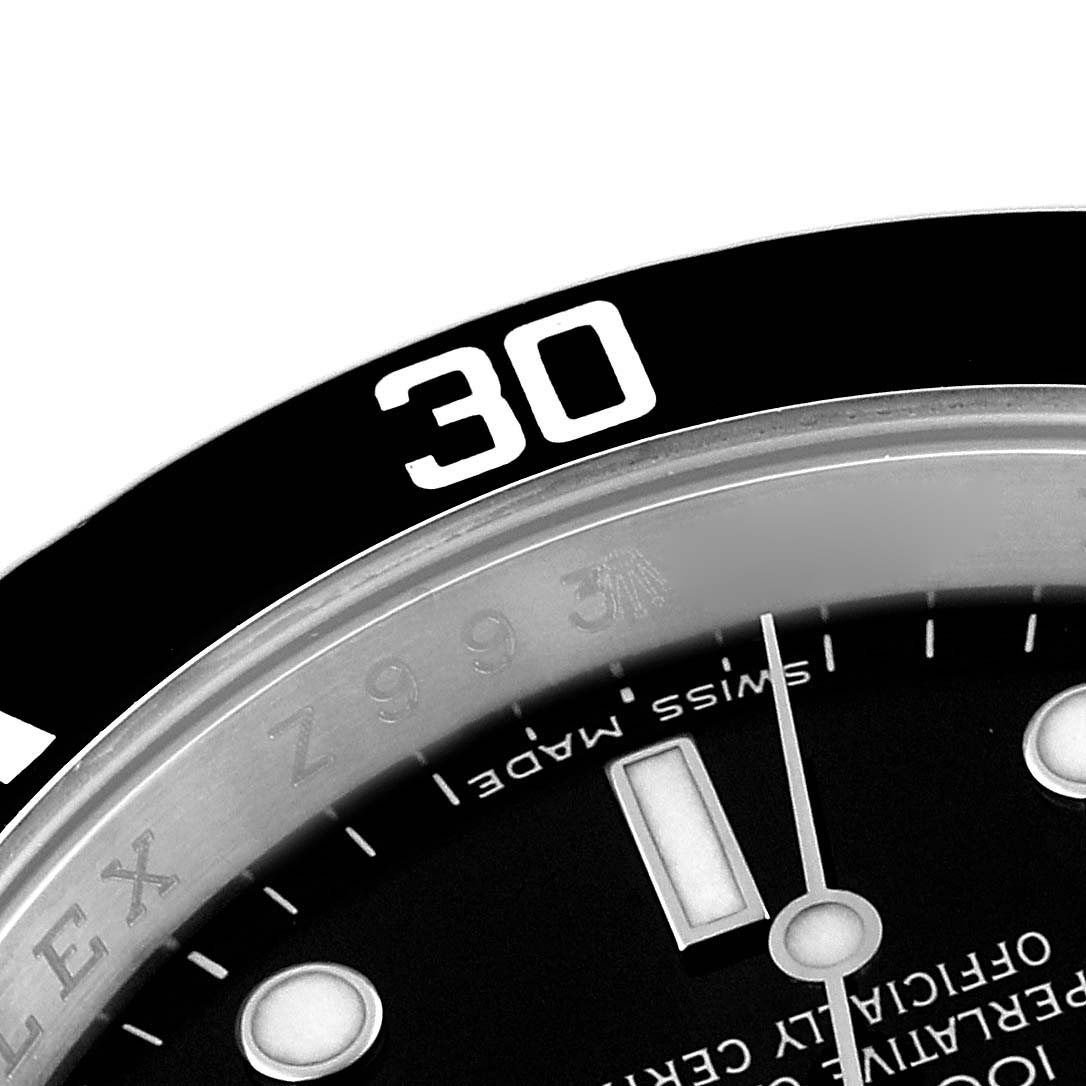 This close-up angle shows the bezel, dial, and part of the minute hand on the Rolex Submariner 16610 Men
s Stainless Steel Black Dial 16610 Men
s Stainless Steel Black Dial watch.