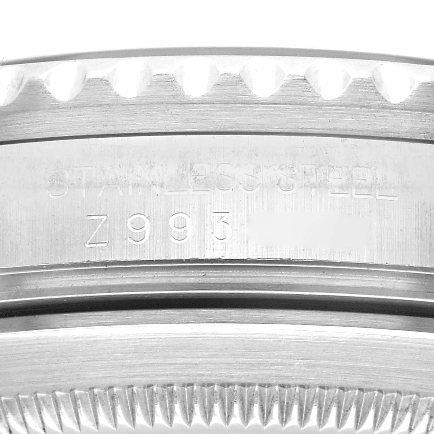 The image shows a close-up of the side engraving on the bezel of a Rolex Submariner 16610 Men
s Stainless Steel Black Dial 16610 Men
s Stainless Steel Black Dial watch.