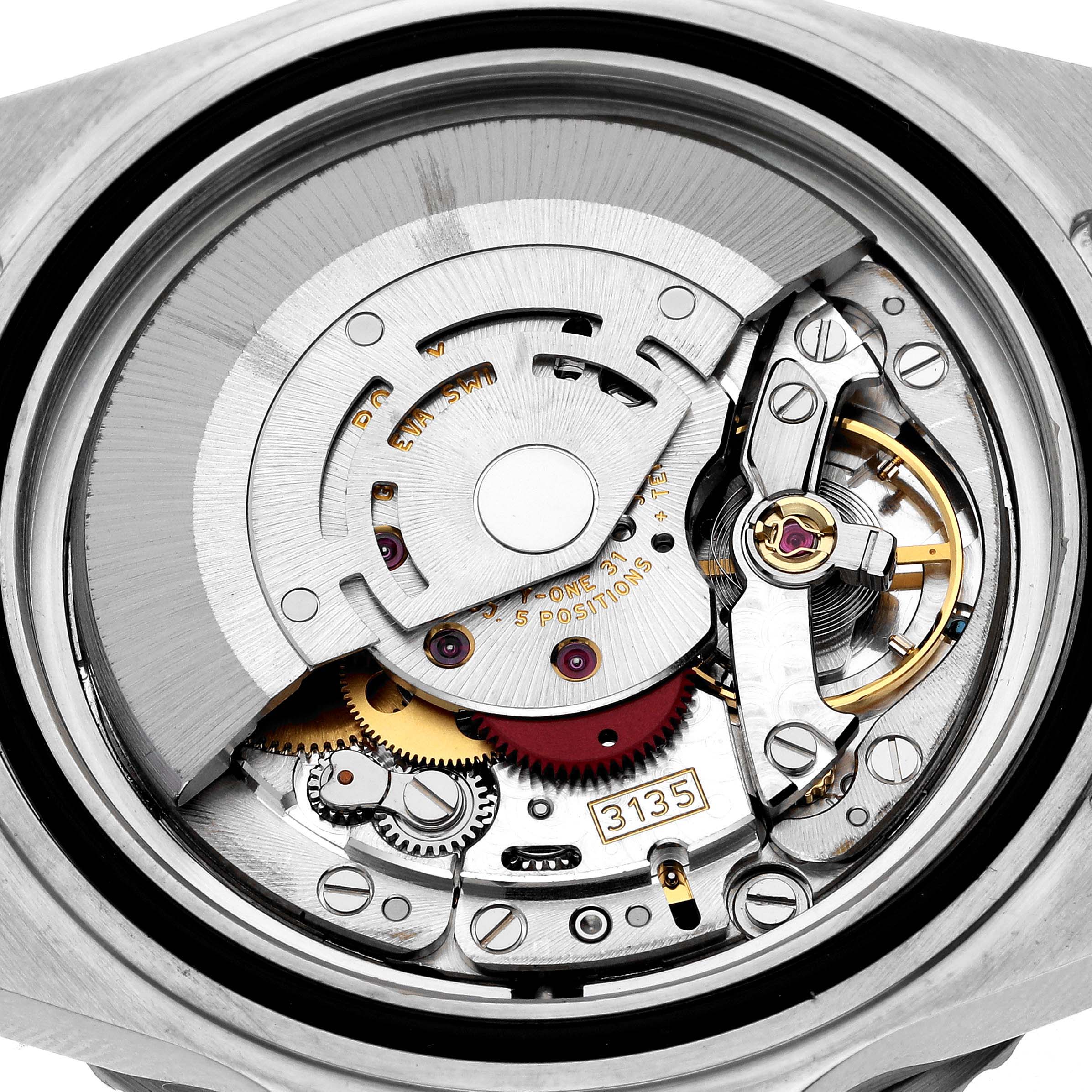 The image shows the internal mechanics and movement of the Rolex Submariner 16610 Men
s Stainless Steel Black Dial 16610 Men
s Stainless Steel Black Dial watch from a back view angle.