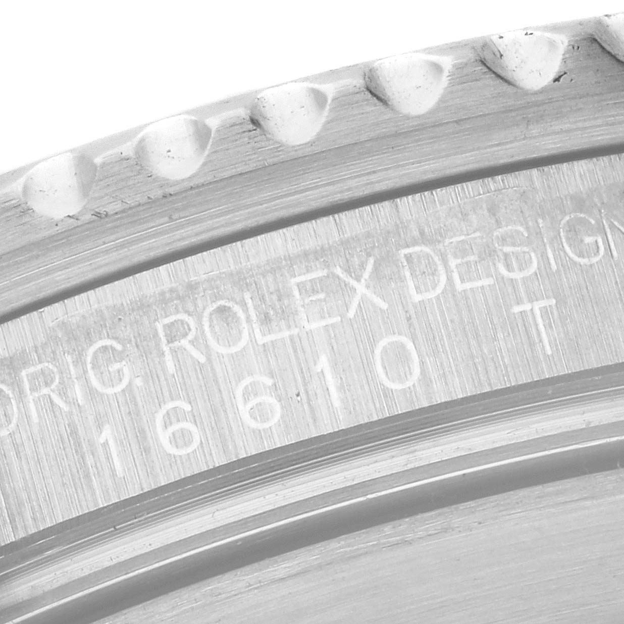 This is a close-up image of the engraved case back and bezel edge of a Rolex Submariner 16610 Men
s Stainless Steel Black Dial 16610 Men
s Stainless Steel Black Dial watch, showing the model number 16610.