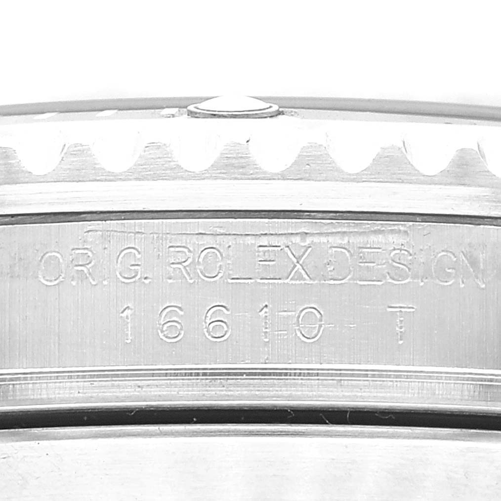 Close-up of the side of a Rolex Submariner 16610 Men
s Stainless Steel Black Dial 16610 Men
s Stainless Steel Black Dial watch, showing the engraved model number "16610".
