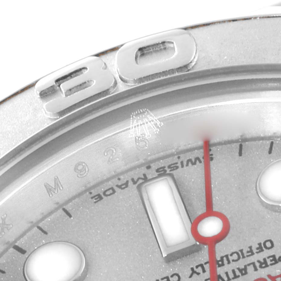 This close-up of a Rolex Yacht-Master 169622 Women
s Stainless Steel Silver Dial 169622 Women
s Stainless Steel Silver Dial watch shows the bezel and part of the face with markers and text.