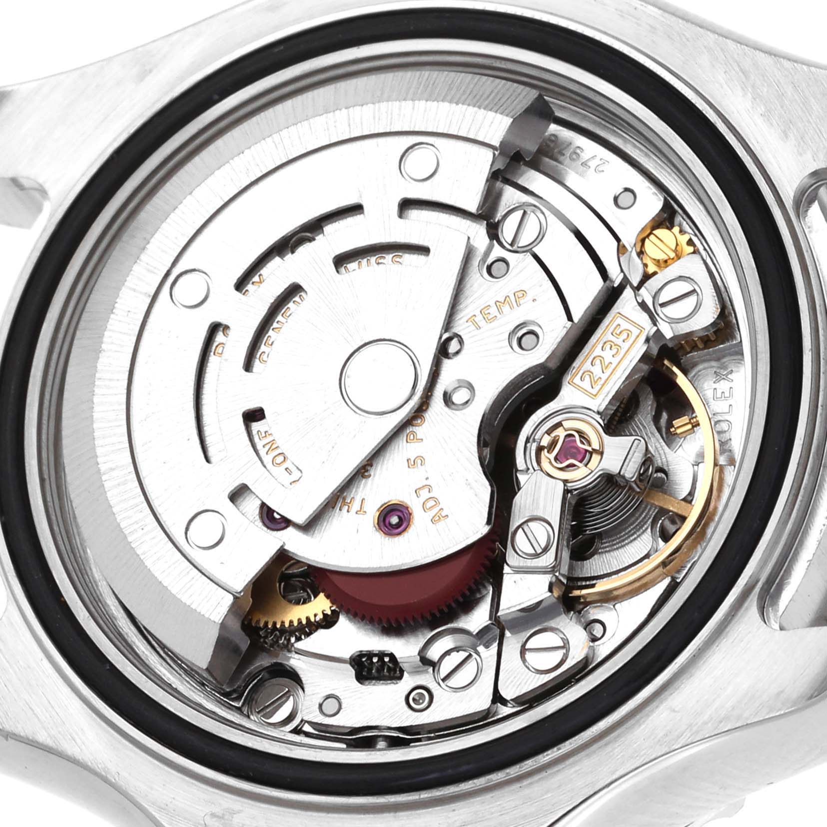 The image shows a close-up view of the Yacht-Master Rolex
s internal movement, including gears, screws, and the rotor.