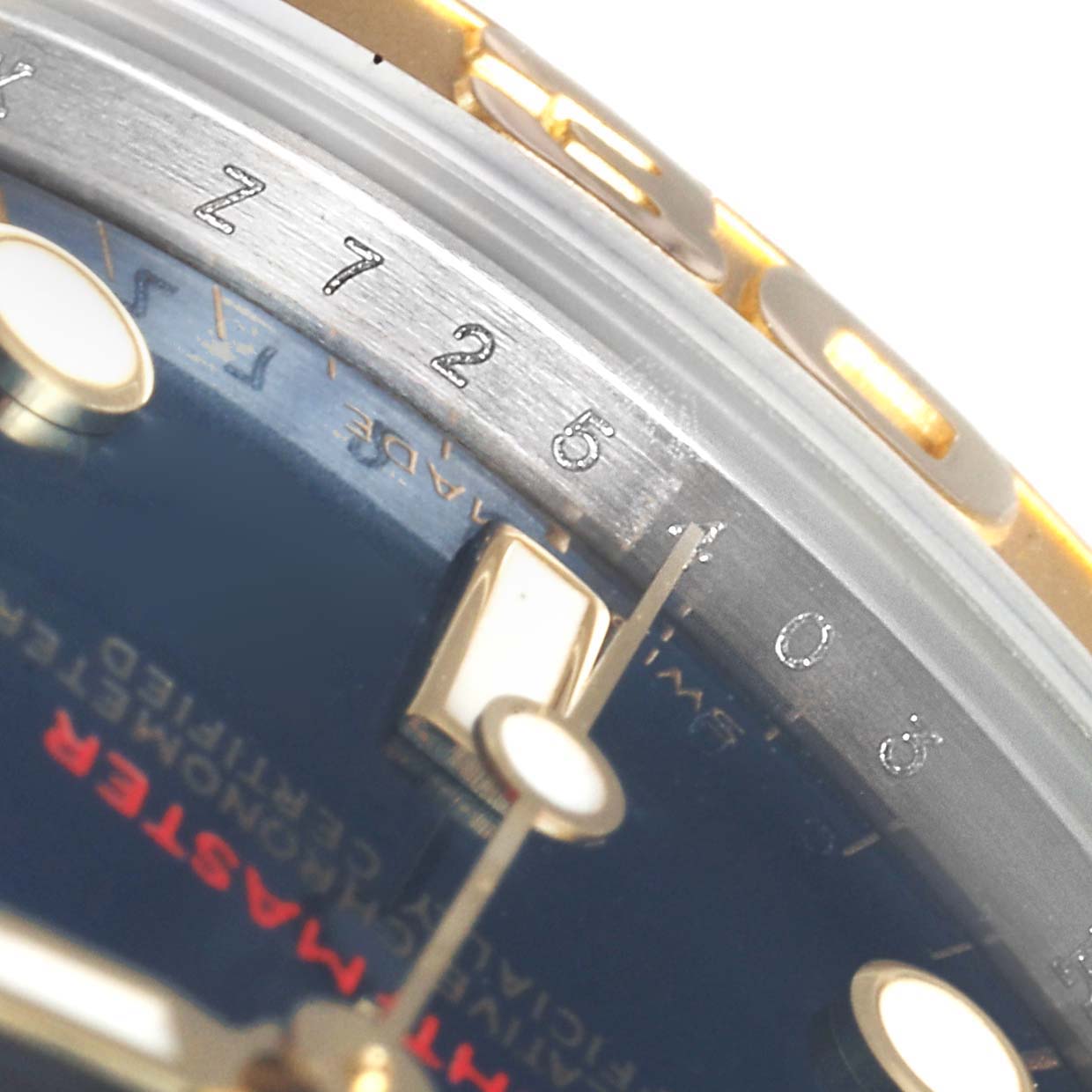 The image shows a close-up angle of the Rolex Yacht-Master 168623 Men's Steel and Gold (two tone) Blue Dial 168623 Men's Steel and Gold (two tone) Blue Dial watch, focusing on the edge of the dial and part of the bezel.
